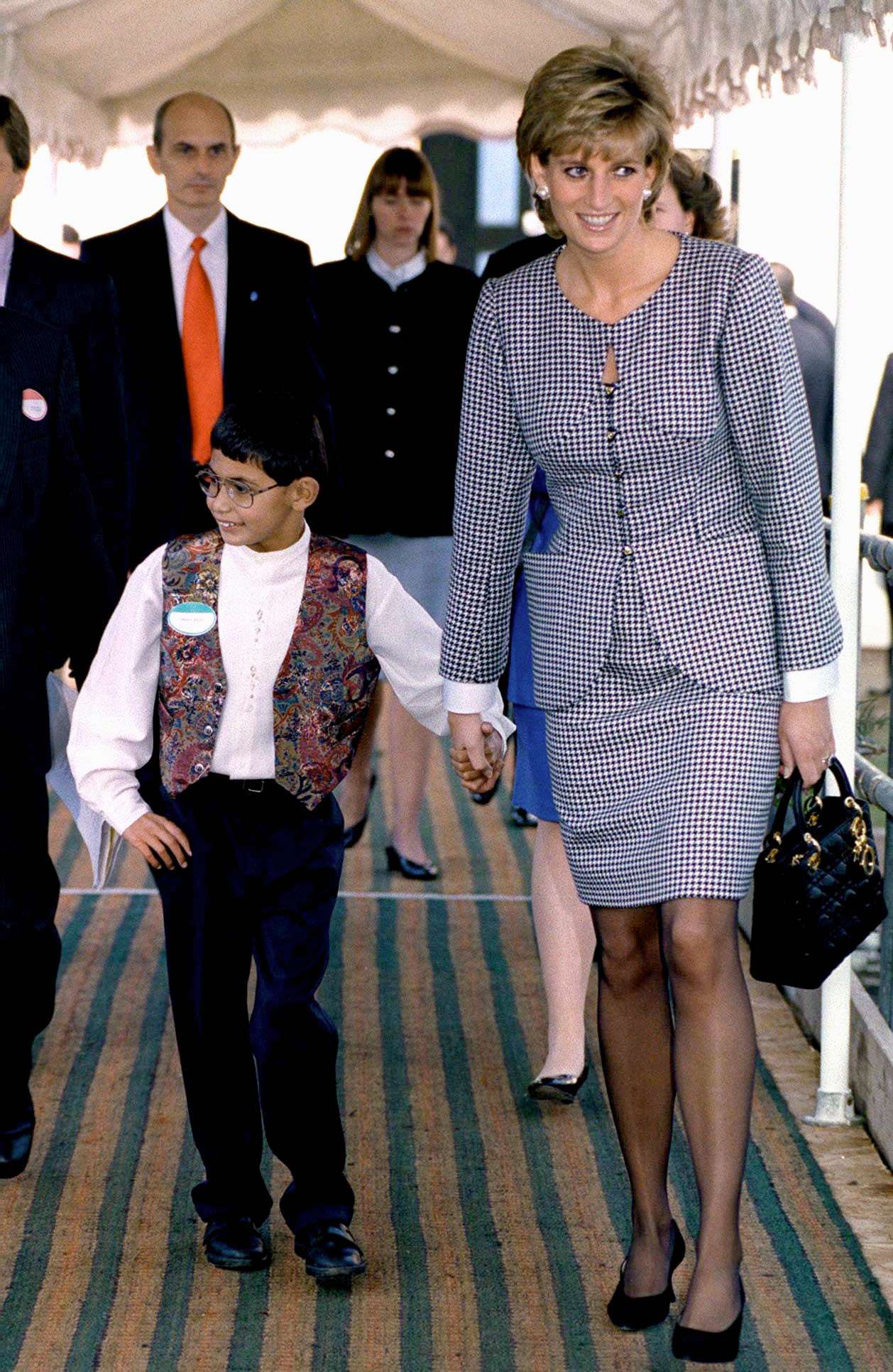 Diana Holding Hands With Boy