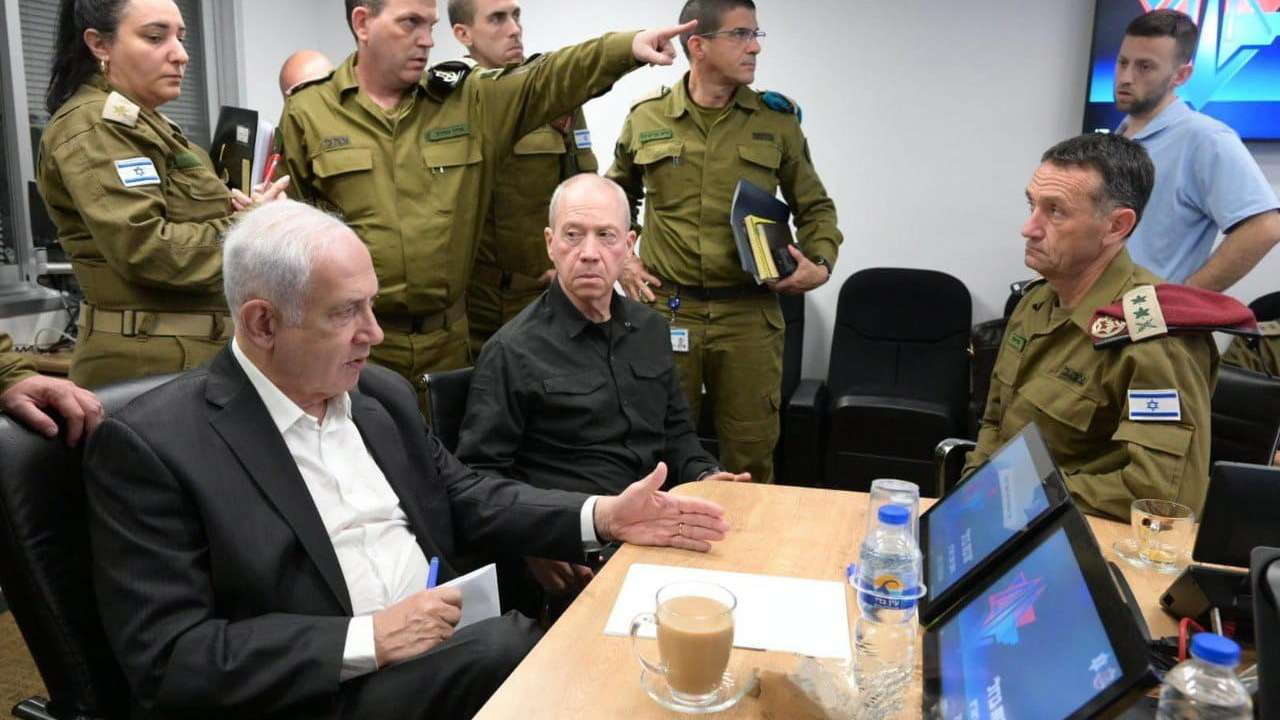 epa10907440 A handout photo made available by the Israeli Government Press Office shows Israeli Prime Minister Benjamin Netanyahu (L) during a situation assessment meeting in Tel Aviv, Israel, 08 October 2023. Rocket barrages were launched from the Gaza Strip as of early 07 October in a surprise attack claimed by the Islamist movement Hamas. The Israeli Security Cabinet approved the war situation and is taking significant military steps, the prime minister's office announced on 08 October.  EPA/AMOS BEN-GERSHOM/GPO HANDOUT  HANDOUT EDITORIAL USE ONLY/NO SALES