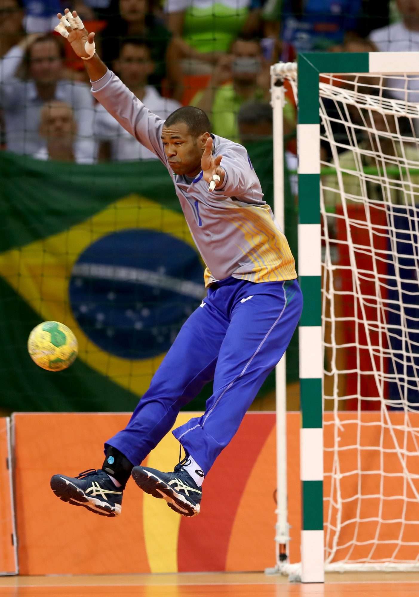 RIO DE JANEIRO, BRAZIL - AUGUST 09: Maik dos Santos #1 of Brazil stops a shot by Slovenia in the second half on Day 4 of the Rio 2016 Olympic Games at the Future Arena on August 9, 2016 in Rio de Janeiro, Brazil. (Photo by Elsa/Getty Images)