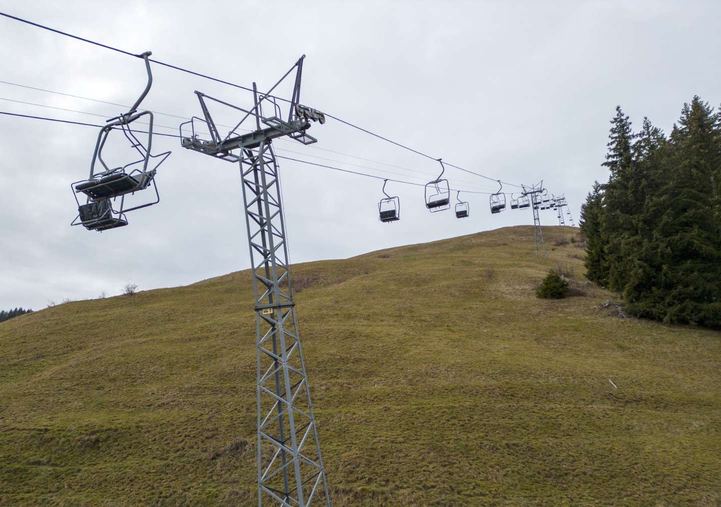 View of a closed chair-lift of Les Fers amid warmer-than-usual winter temperatures in the Alps in Leysin, Switzerland, January 4, 2023. REUTERS/Denis Balibouse