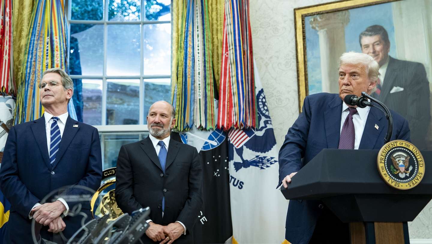 epa12287419 (L-R) Treasury Secretary Scott Bessent, Commerce Secretary Howard Lutnick look on as President Donald Trump and Apple CEO Tim Cook announce an additional $100 billion Apple investment in the US in the Oval Office of the White House in Washington, DC, USA, 06 August 2025. The White House will also establish the Apple American Manufacturing Program, which will focus on bringing Apple’s supply chain and manufacturing to the US.  EPA/BONNIE CASH / POOL