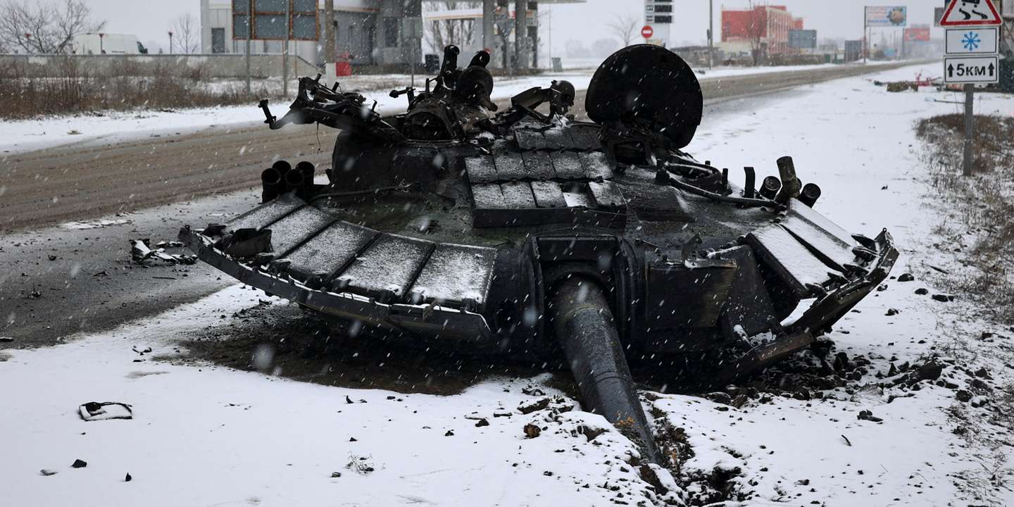 epa09784972 A turret of burned Russian tank is left abandoned after the Ukrainian army attacked it the previous day near the city of Kharkiv, Ukraine, 25 February 2022. Russian troops entered Ukraine on 24 February prompting the country's president to declare martial law and triggering a series of announcements by Western countries to impose severe economic sanctions on Russia.  EPA/SERGEY KOZLOV