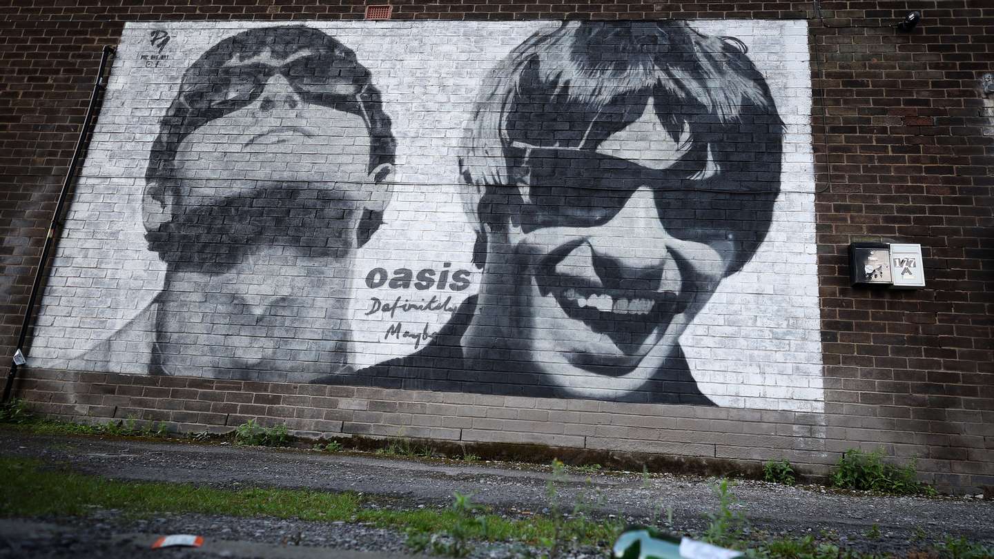 epa11570722 A mural of Liam and Noel Gallagher of British band Oasis is seen near Sifters Records in Manchester, Britain, 29 August 2024. The mural was painted by street artist Pic.One.Art in June 2024 to mark the 30th anniversary of the band’s debut album, Definitely Maybe. Oasis have announced a number of live reunion concert dates in Cardiff, Manchester, London, Edinburgh, and Dublin, having reformed after a 15-year split.  EPA/ADAM VAUGHAN