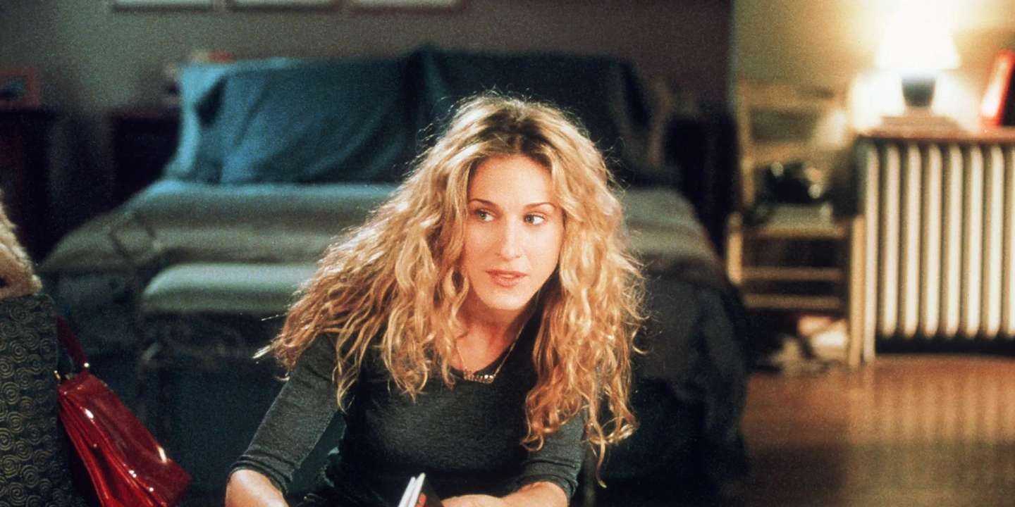 Carrie Bradshaw, famosa escritora, it girl de Nova Iorque e arrendatária de um dos mais famosos apartamentos de Nova Iorque