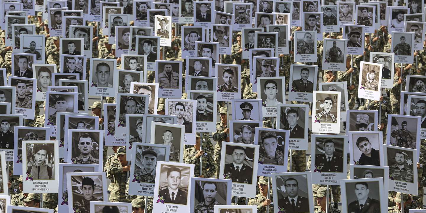 epaselect epa09491519 Azeri soldiers carry portraits of the servicemen and civil people who was killed during the Second Karabakh War at the commemorative march on the anniversary of the start of the war in downtown of Baku, Azerbaijan, 27 September 2021. One year ago battles began on the line of demarcation between Azerbaijan and the unrecognized Nagorno-Karabakh Republic (NKR), which lasted 44 days until November 10.  As a result of the war, Baku regained a number of territories lost in the early 1990s. On November 9, Azerbaijan, Armenia and Russia adopted a trilateral statement on a complete ceasefire in Nagorno-Karabakh. According to information disseminated by the Ministry of Defense of the Republic of Azerbaijan, 2,783 servicemen of our Armed Forces were killed in the Patriotic War.  EPA/ROMAN ISMAYILOV