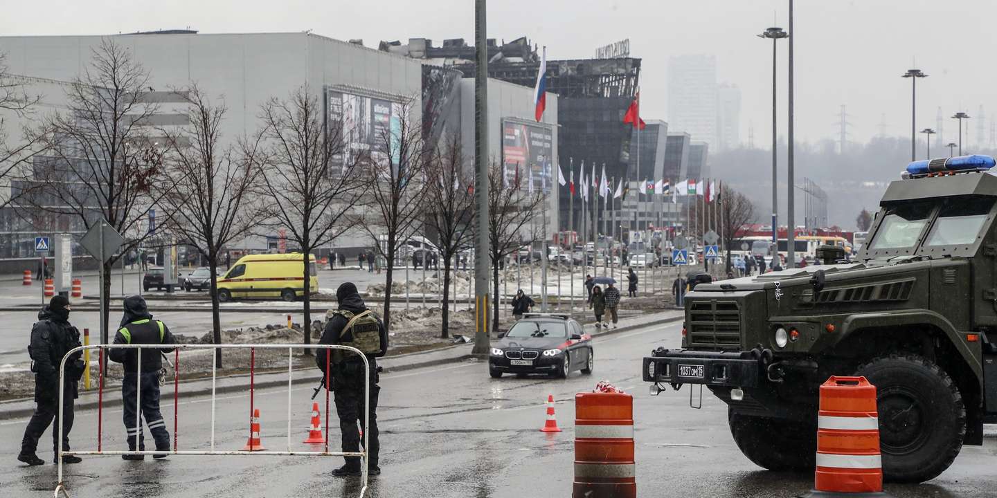 epa11238298 Russian policemen guard near the burned Crocus City Hall concert venue following a terrorist attack in Krasnogorsk, outside Moscow, Russia, 23 March 2024. On 22 March evening, a group of up to five gunmen attacked the Crocus City Hall in the Moscow region, Russian emergency services said. 93 people were killed and more than 100 others were hospitalized, the Investigative Committee confirmed. The head of the Russian FSB, Alexander Bortnikov, reported to Russian President Vladimir Putin on 23 March on the arrest of 11 people, including all four terrorists directly involved in the terrorist attack.  EPA/MAXIM SHIPENKOV