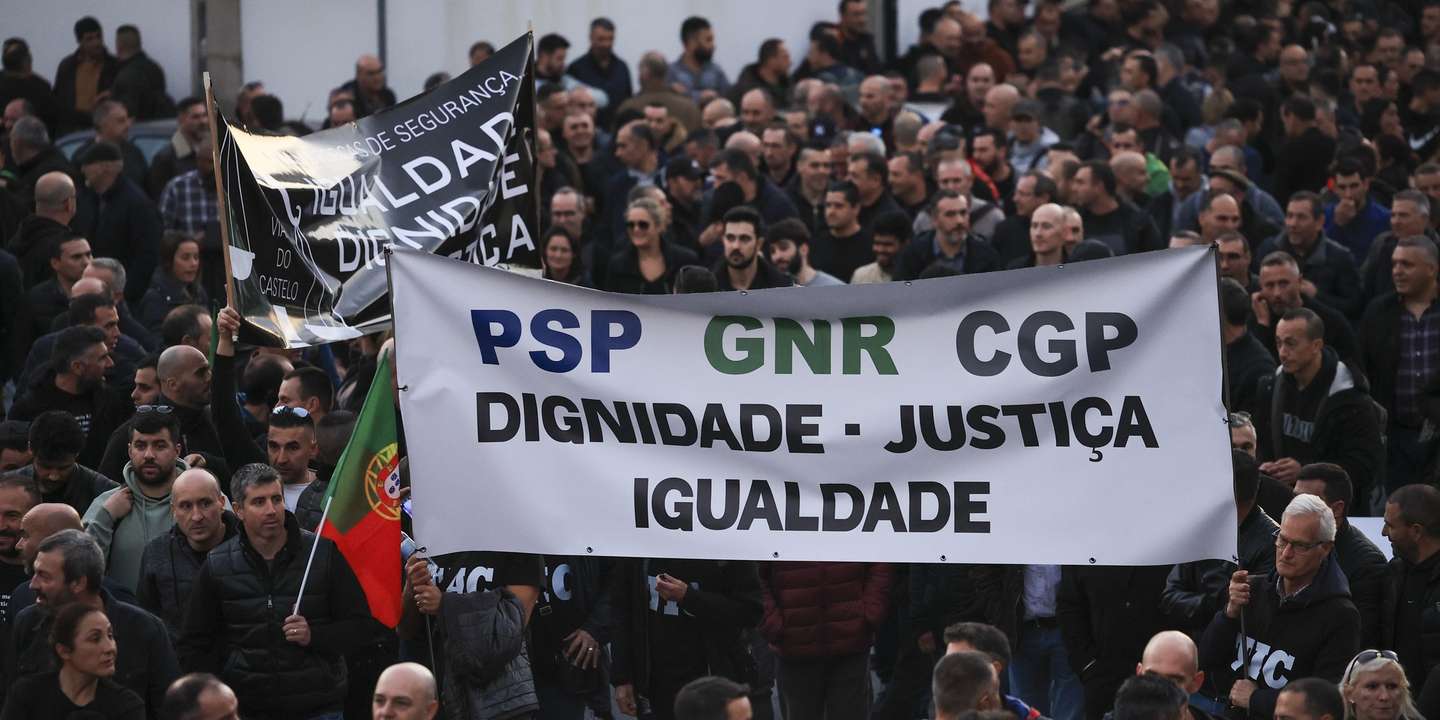 Police officers hold a banner with the words "Dignity, Justice, Equality" protest during a demonstration by the platform of PSP (Public Security Police) unions and GNR (National Republican Guard) associations for the restructuring of pay supplements and for the enhancement and dignification of professionals, Porto, Portugal, 31 January 2024.  ESTELA SILVA/LUSA