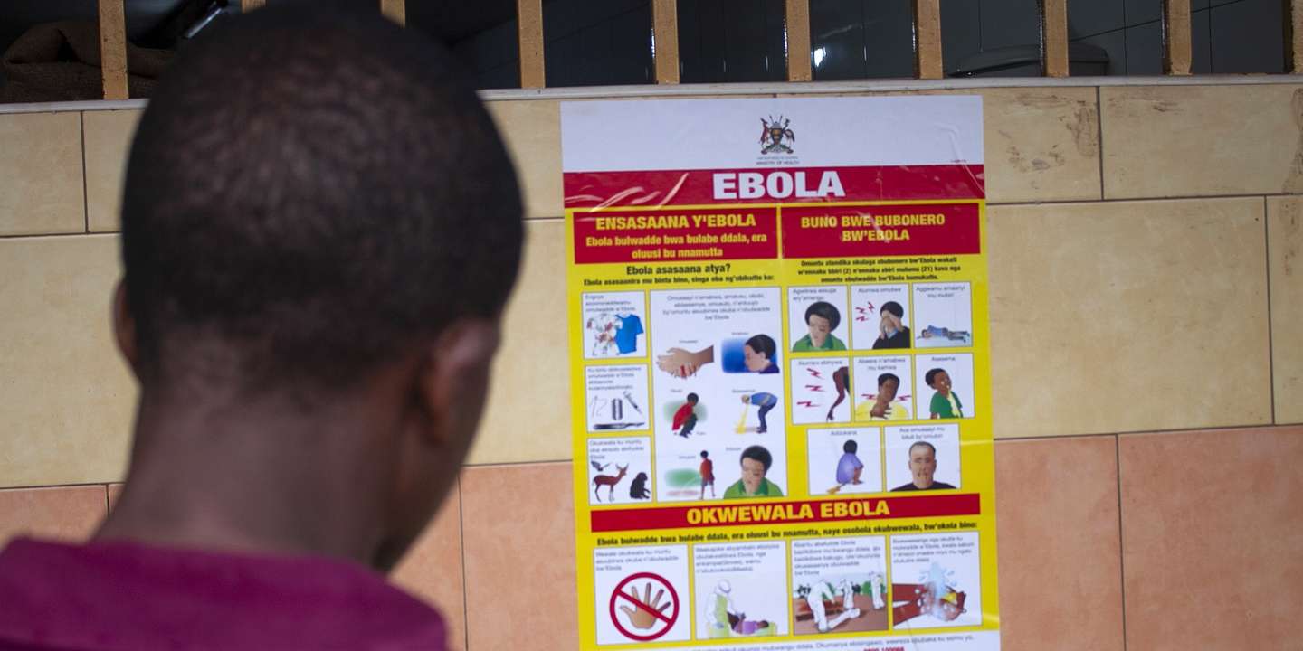epa10212386 A man looks at an Ebola virus disease awareness campaign poster following an outbreak of Ebola in Uganda, in Kampala, Uganda, 28 September 2022. According to Uganda's Health Ministry, Ebola infections have risen across some districts in Uganda with the number of confirmed and suspected deaths at 36. The president addressed the nation on measures the government is putting in place to mitigate the spread.  EPA/Stringer