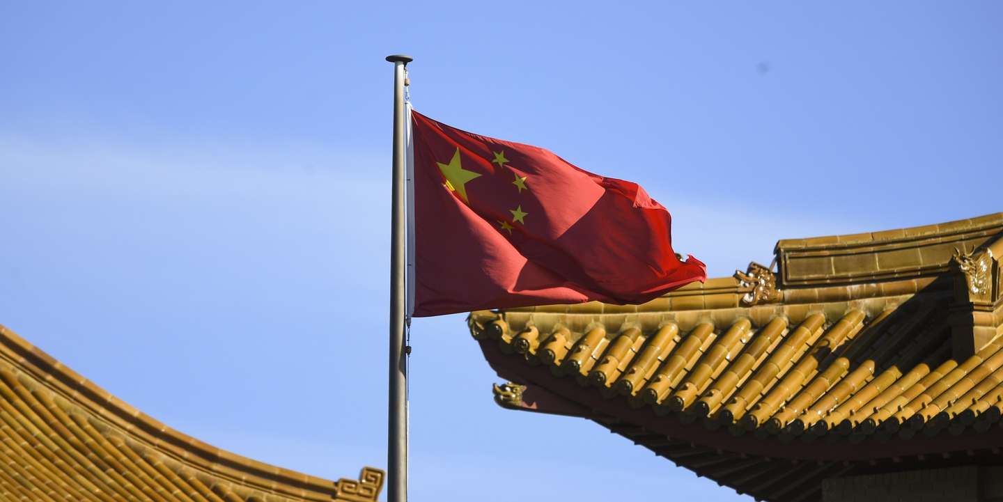 epa08852336 A Chinese national flag flies at the Chinese Embassy in in Canberra, Australia, 30 November 2020. On 30 November, Australian Prime Minister Scott Morrison call for China to apologise for a social media post depicted an Australian soldier murdering an Afghan child. According to the Australian government, China's Foreign Ministry spokesman Lijian Zhao posted the image.  EPA/LUKAS COCH AUSTRALIA AND NEW ZEALAND OUT