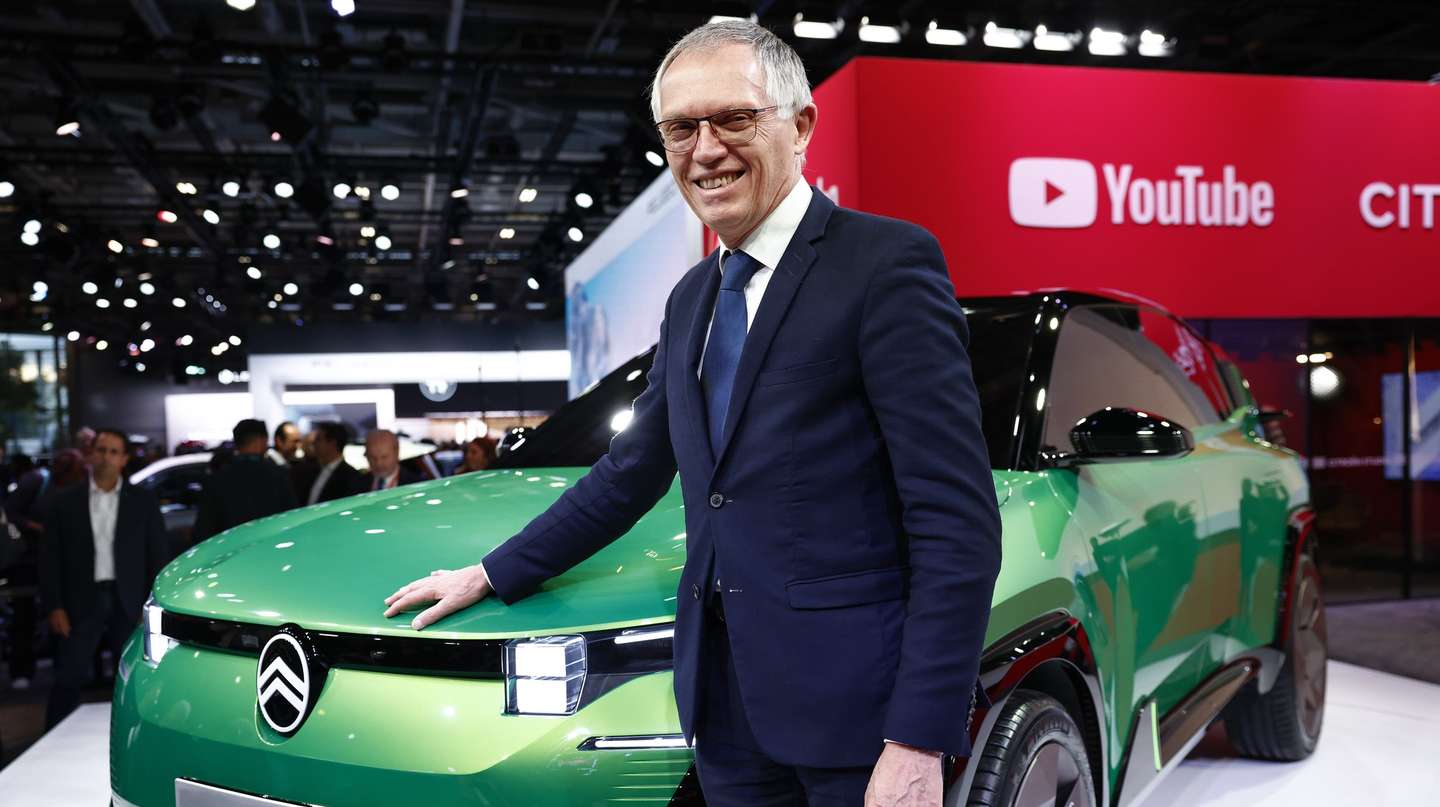 epa11658128 CEO of Stellantis Carlos Tavares poses next to the C5 Aircross Concept Citroen car during the Mondial de l'Auto – Paris Motor Show 2024 in Paris, France, 14 October 2024. The 2024 Paris Motor Show showcases hundreds of vehicles from 14 to 20 October 2024.  EPA/YOAN VALAT