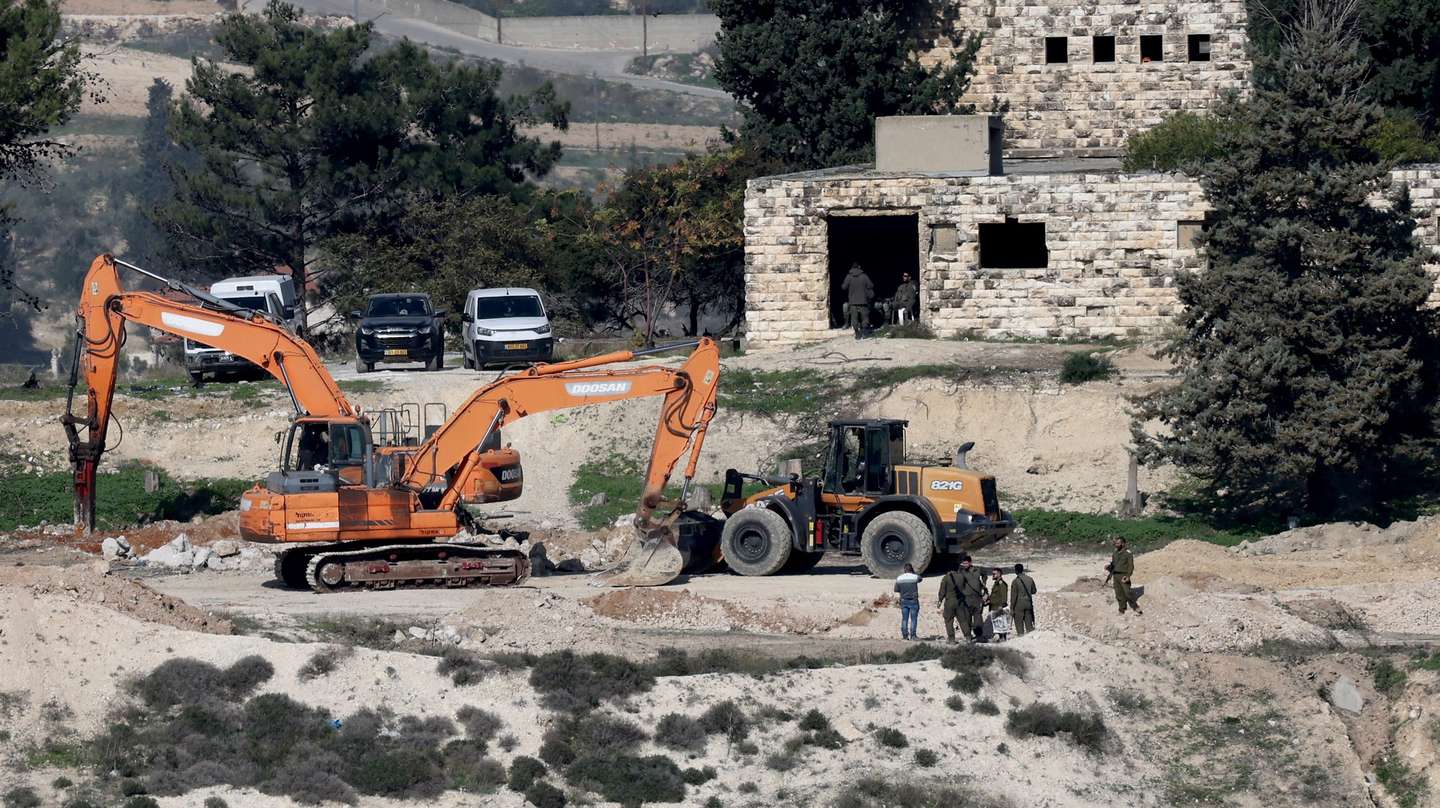 epa12609811 Israeli bulldozers level land at the evacuated Israeli settlement of Sanur, near the West Bank city of Jenin, 23 December 2025. Israel's security cabinet on 21 December approved the establishment of 19 new settlements in the West Bank, a move described by the finance minister as aimed at preventing the establishment of a Palestinian state. Sanur is one of four settlements in the northern West Bank that were evacuated in 2005, when the government of Ariel Sharon withdrew from the Gaza Strip and from four West Bank settlements.  EPA/ALAA BADARNEH