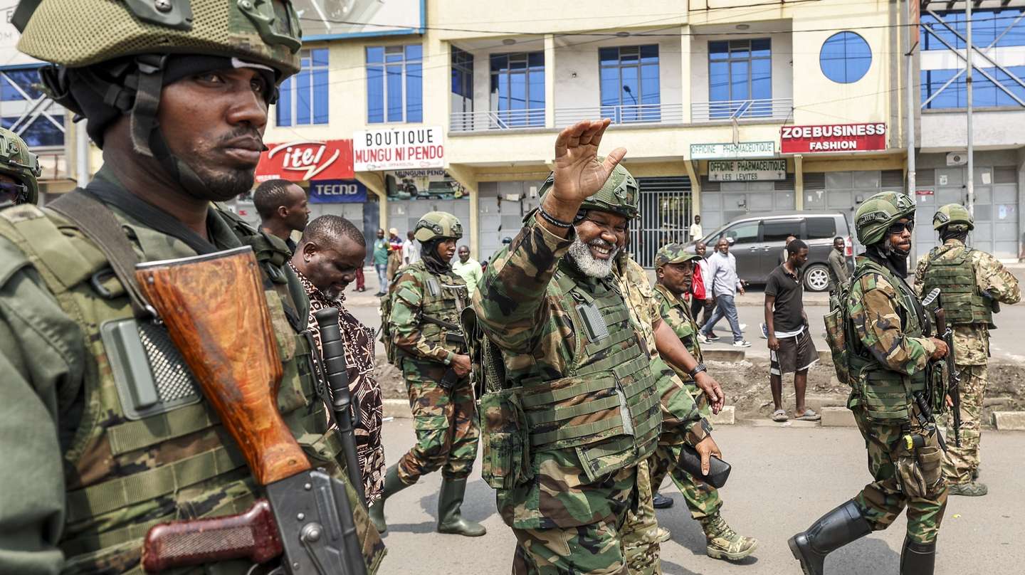 epa11868072 Leader of Alliance Fleuve Congo (AFC) Corneille Nangaa (C) waves as he arrives to participate in a cleanup exercise of the city of Goma, Democratic Republic of the Congo, 01 February 2025. The M23 (March 23 Movement) rebel group called for all residents to participate in a cleaning exercise of Goma city, the capital of the North Kivu Province, days after claiming to have captured most of it after launching a large-scale offensive in the east of the DR Congo, which the DR Congo and the UN accuse Rwanda of backing.  EPA/DANIEL IRUNGU