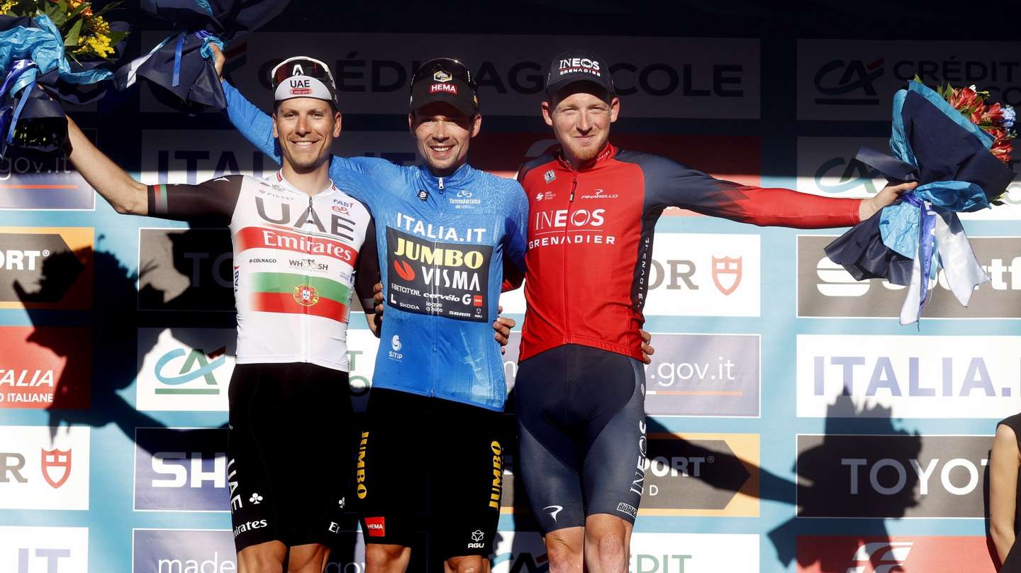epa10517132 (L-R) second placed Joao Almeida of Portugal - UAE Team Emirates, winner Primoz Roglic of Slovenia - Jumbo - Visma), and third placed Tao Geoghegan Hart of Britain - INEOS Grenadiers, celebrate on the podium after the 7th stage of the 58th edition Tirreno Adriatico from San Benedetto del Tronto to San del Benedetto Tronto 154 km, 12 March 2023.  EPA/ROBERTO BETTINI