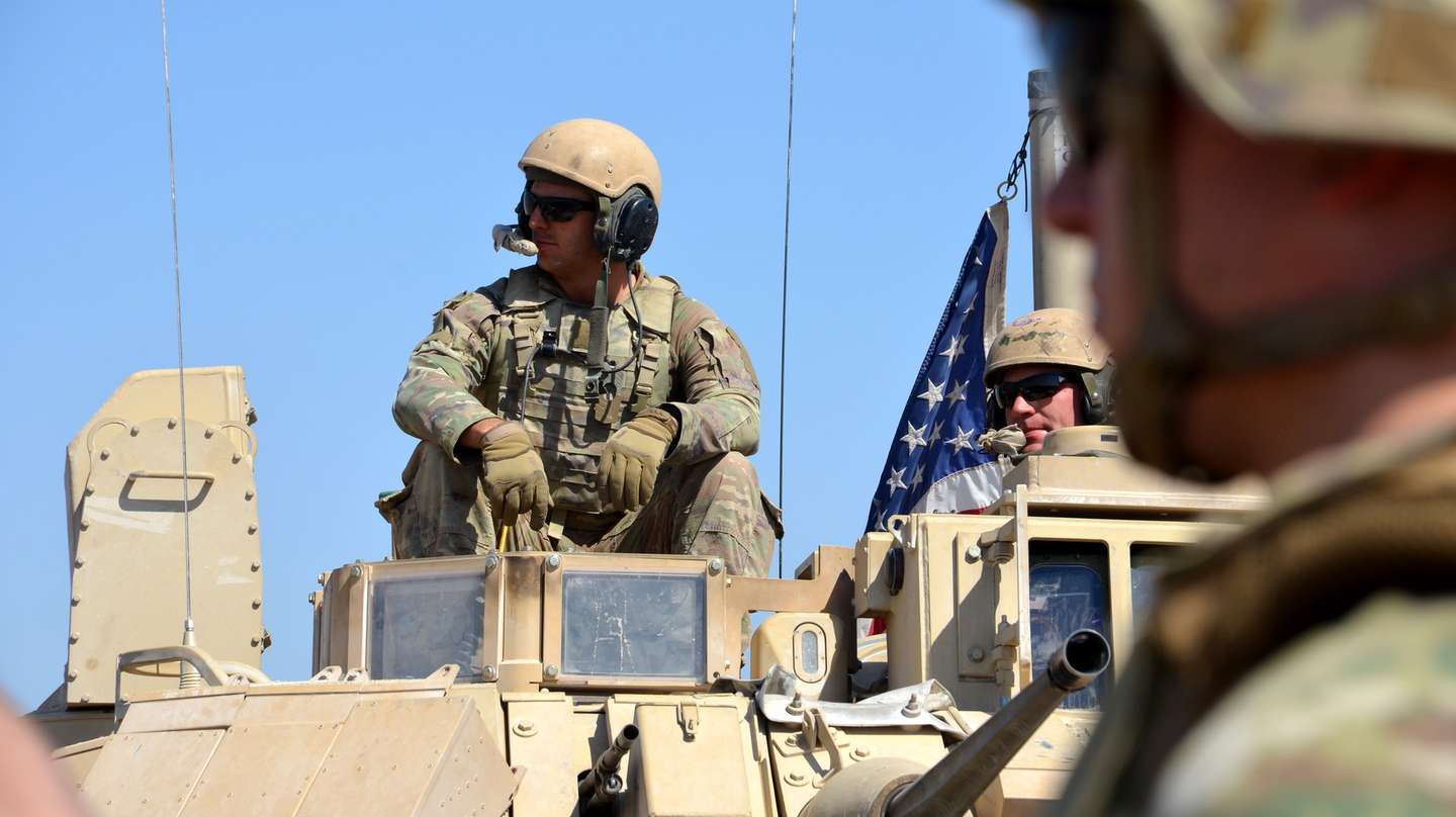 epa10167543 US soldiers take part in Military exercises with Syria democratic forces (SDF) at Dayrik town close to the tri-border between Syria, Iraq, and Turkey in al-Hasakah governorate, northeastern Syria, 07 September 2022. The US-led coalition carried out the first joint military exercise with the Syrian Democratic Forces (SDF) in the border village of Taqil Baqil in Derik district near the tri-border between Syria, Iraq, and Turkey. The SDF said that the maneuver aims to raise the readiness of the SDF and make it ready to repel possible attacks that launched by ISIS cells in the region.  EPA/AHMED MARDNLI
