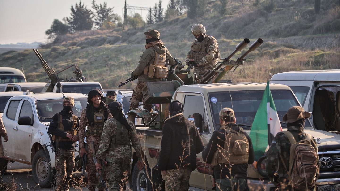 epaselect epa11946985 Syrian security forces with heavy weapons take part in an operation following attacks carried out against Syrian security forces, in Latakia, Syria, 07 March 2025. At least 16 Syrian security officers were killed by supporters of former president Bashar al-Assad on 06 March in the coastal province of Latakia, security forces said.  EPA/BILAL AL HAMMOUD