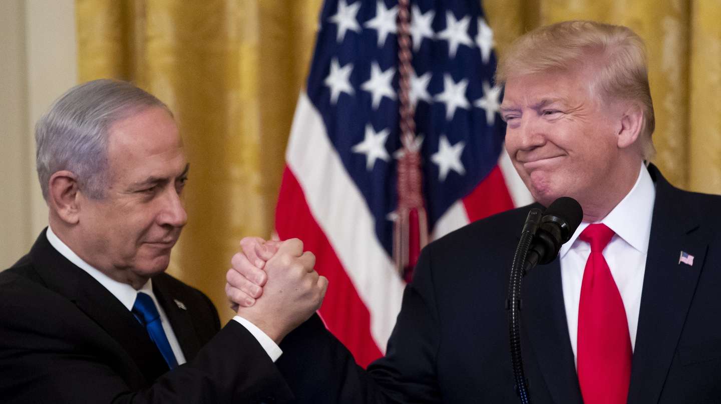 epa08939629 (FILE) US President Donald J. Trump (R) shakes hands with Prime Minister of Israel Benjamin Netanyahu (L) while unveiling his Middle East peace plan in the East Room of the White House, in Washington, DC, USA, 28 January 2020. The presidency of Donald Trump, which records two presidential impeachments, will end at noon on 20 January 2021.  EPA/MICHAEL REYNOLDS *** Local Caption *** 55828472