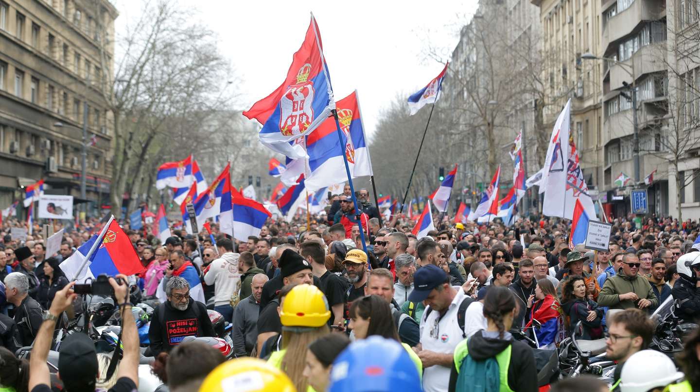 epa11965648 Protesters wave Serbian flags during the student-led rally in Belgrade, Serbia, 15 March 2025.  University students staged a protest, demanding accountability after fifteen people lost their lives in the collapse of the Novi Sad Railway Station canopy in November 2024. The station building, which had been renovated and reopened in July 2024, was undergoing further renovations shortly before the collapse.  EPA/ANDREJ CUKIC