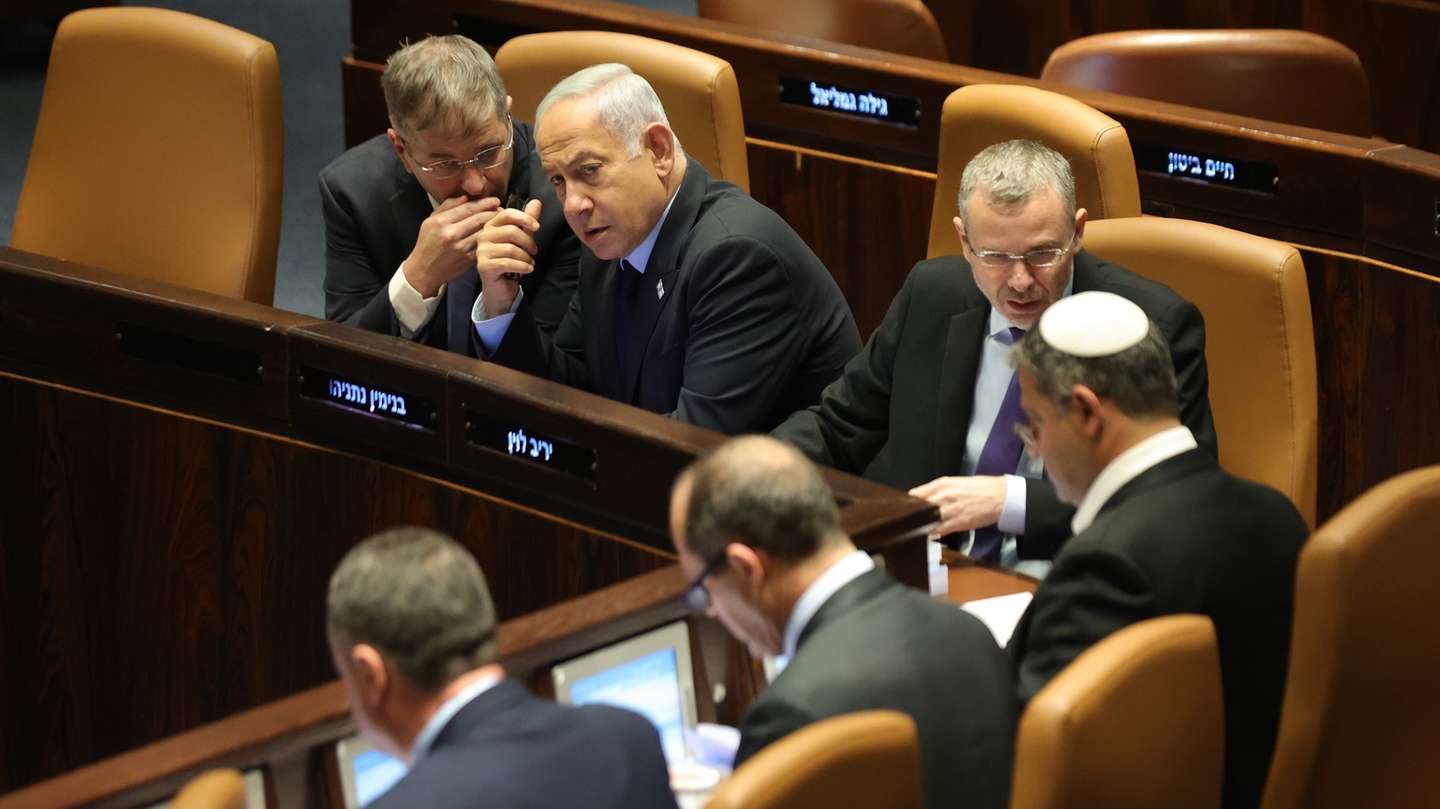epa10536863 Israeli Prime Minister Benjamin Netanyahu (2-L) attends a voting session on judicial reform bill at the Knesset Plenum, in Jerusalem, Israel, 22 March 2023. Nationwide protests against the government's judicial reform plans are being held for 12 weeks in a row. Israel's parliament passed a draft law limiting the power of the Israeli Supreme Court in a first reading on 14 March.  EPA/ABIR SULTAN
