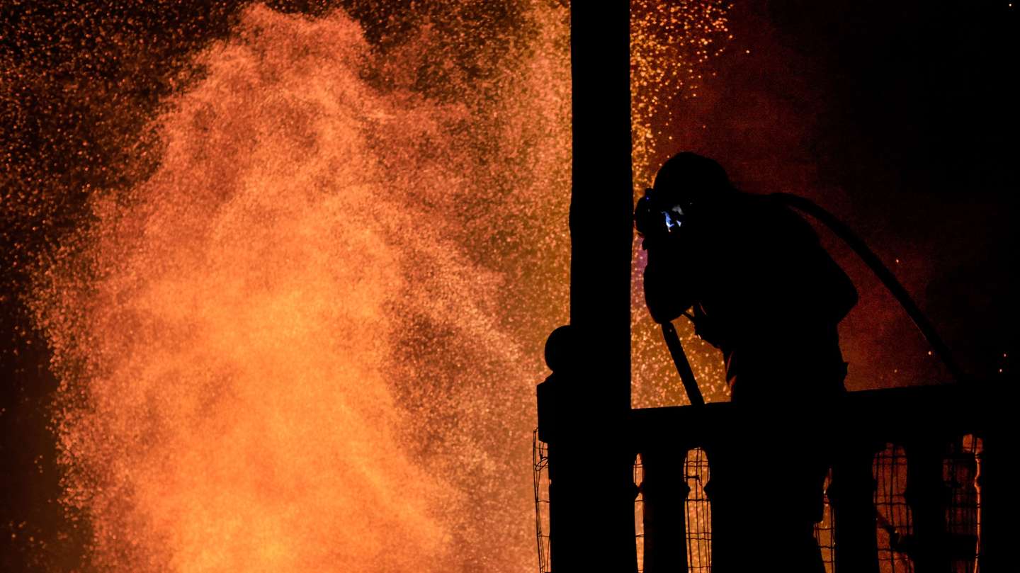 Firefighters fight a forest fire in Zimao, Vila Pouca de Aguiar, Portugal, 16 September 2024. The situation has worsened in the fire in Vila Pouca de Aguiar, which is approaching the village of Vila Meã, said the mayor today, who asked for more resources to fight the three fires in the municipality. 99 operational and 32 vehicles are fighting the forest fire. PEDRO SARMENTO COSTA/LUSA