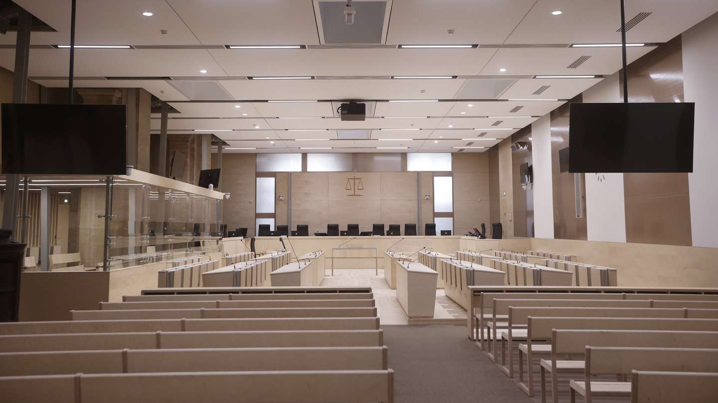 epa09442661 An interior view of the temporary courtroom prepared for trial over 2015 terrorist attacks at the courthouse in Paris, France, 02 September 2021. The trial over the 13 November 2015 terrorist attacks is due to start on 08 September 2021 and will last nine months. The attacks killed 130 people with hundreds injured which targeted the Bataclan concert hall, the Stade de France national sports stadium, and several restaurants and bars.  EPA/YOAN VALAT