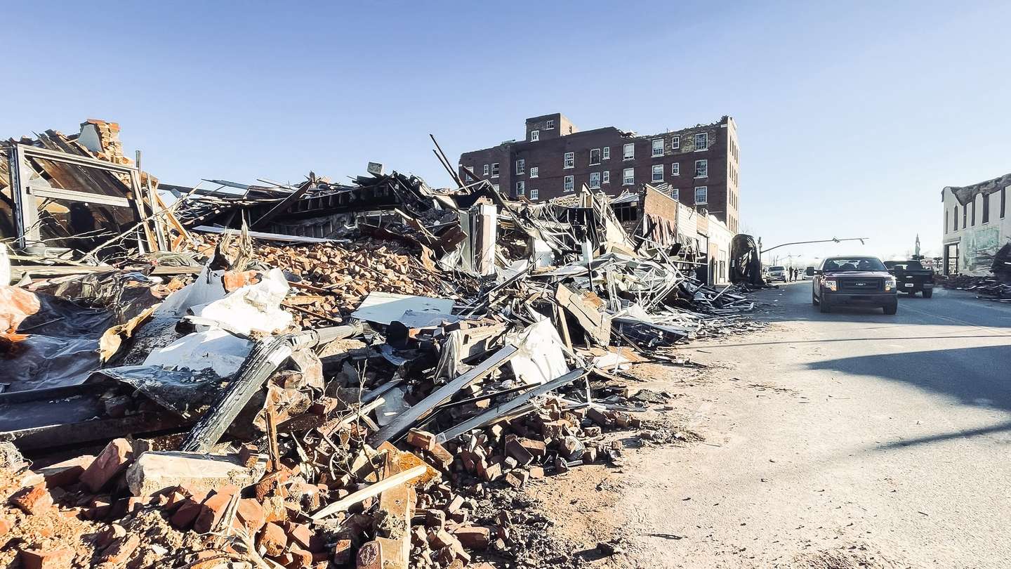 epa09638446 Buildings are damaged by tornados in Mayfield, Kentucky, USA, 12 December 2021. Large storms overnight on 10 December generated multiple tornados along a 200 mile path across six U.S. states, reportedly killing over 70 people.  EPA/TANNEN MAURY