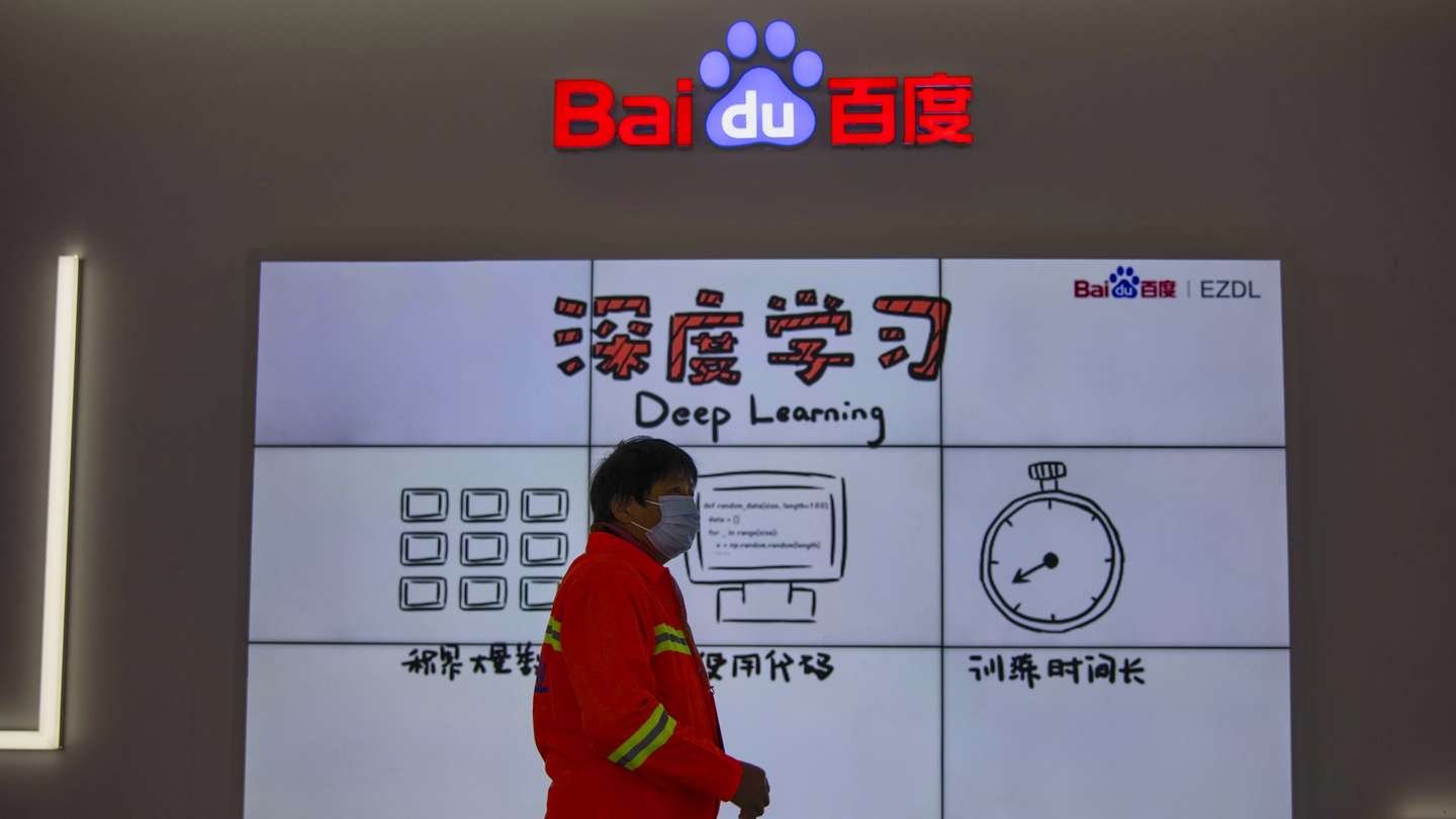 epa08837102 A woman walks in front of the Baidu booth on “Light Of The Internet Expo” during World Internet Conference in Wuzhen, Zhejiang Province, China, 23 November 2020. The World Internet Conference, also known as Wuzhen Summit is a two day conference held on 23 to 24 November.  EPA/ALEX PLAVEVSKI