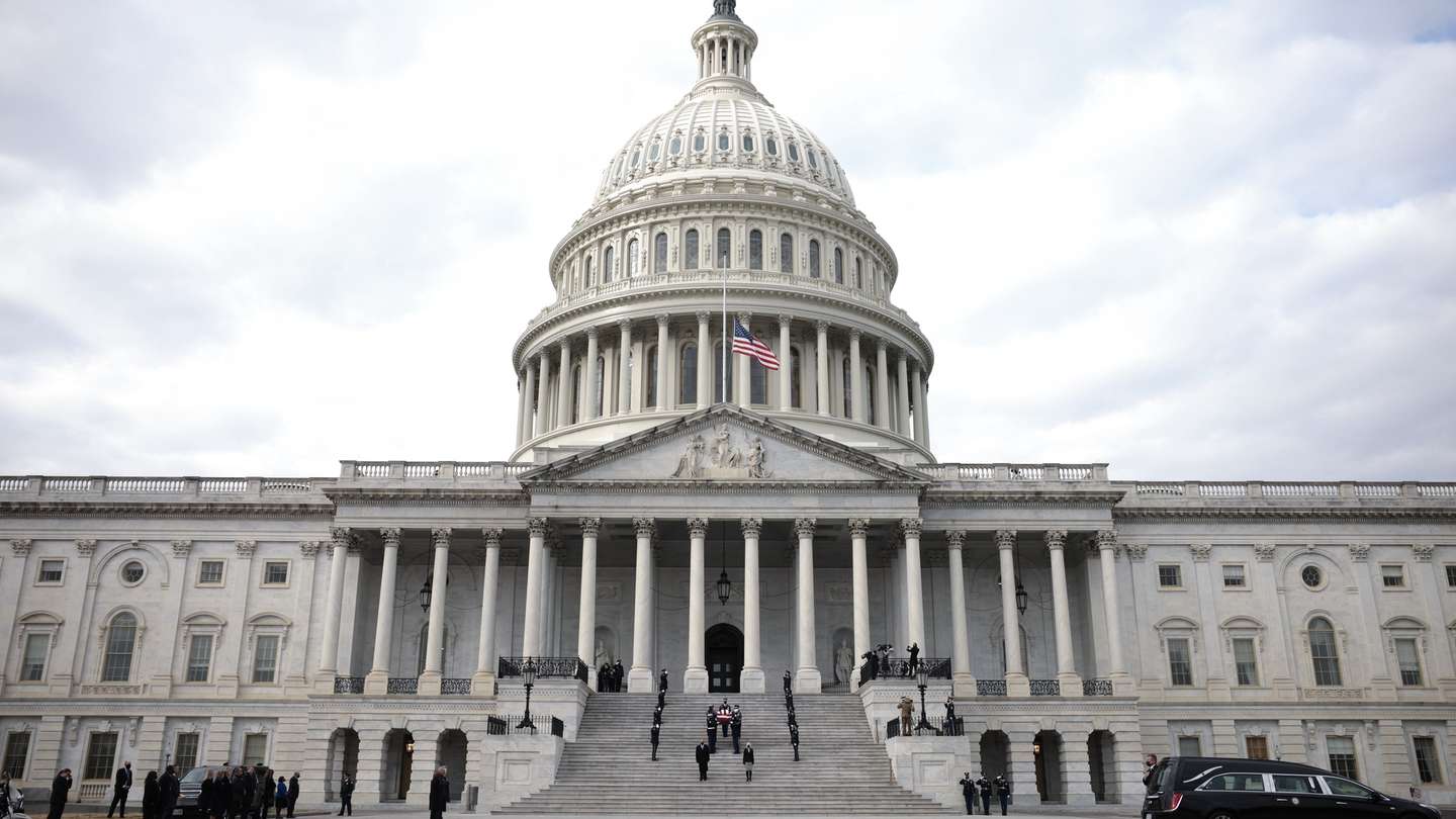 epa09634369 A joint services military honor guard carries the casket of the late Sen. Bob Dole (R-KS) down the steps of the U.S. Capitol after lying in state, in Washington, DC, USA, 10 December 2021. Dole died on 05 December at the age of 98.  EPA/Anna Moneymaker / POOL