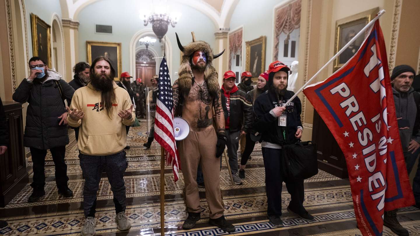 epa09664285 (14/24) (FILE) - Supporters of US President Trump stand by the door to the Senate chambers after they breached the US Capitol security in Washington, DC, USA, 06 January 2021 (reissued 03 January 2021). Following the November 2020 US presidential election, a tone set by supporters of defeated US President Donald Trump escalated further. Trump, who was refusing to concede the victory of Joe Biden, claiming voter fraud and rigged elections, told supporters and white nationalist extreme-right group Proud Boys to respectively 'Stop the Steal' and to 'stand back and stand by'. His social media accounts were suspended and the alt-right platform Parler gained in user numbers. On 06 January 2021, incumbent US vice president Pence was due to certify the Electoral College votes before Congress, the last step in the process before President-elect Biden was to be sworn in. In the morning, pro-Trump protesters had gathered for the so-called Save America March. Soon after Trump finished his speech at the Ellipse, the crowd marched to the Capitol. The attack had begun. Rioters broke into the Capitol building where the joint Congress session was being held. Lawmakers barricaded themselves inside the chambers and donned tear gas masks while rioters vandalized the building, some even occupying offices such as House Speaker Pelosi's. Eventually in the evening the building was cleared from insurrectionists, and the Congress chambers reconvened their session, confirming Joe Biden as the winner of the 2020 US presidential election. In the aftermath, more than 600 people were charged with federal crimes in connection to the insurgency, and close Trump aides such as Steve Bannon, Mark Meadows and Roger Stone were subpoenaed by the House select committee investigating the attack. Trump himself was acquitted by the Senate in his second impeachment trial, this time for "inciting an insurrection". EPA/JIM LO SCALZO ATTENTION: This Image is part of a PHOTO SET *** Loc