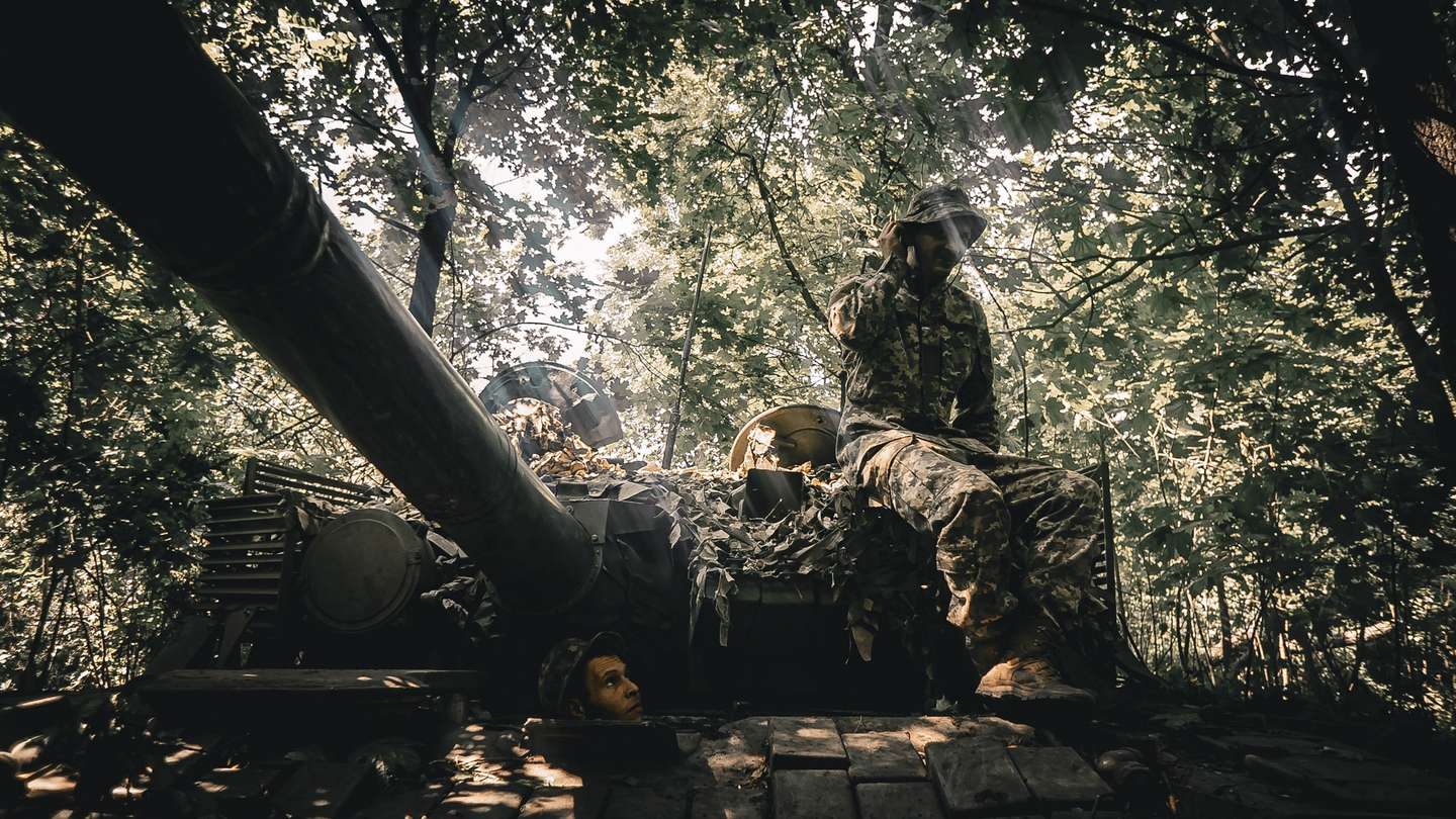 epa10724675 Members of Ukraine's 59th Separate Motorized Infantry Brigade named after Yakiv Handziuk during repair work on a tank near a frontline in the Donetsk direction, eastern Ukraine, 02 July 2023 (issued 03 July 2023), amid the Russian invasion. Russian troops entered Ukrainian territory in February 2022, starting a conflict that has provoked destruction and a humanitarian crisis.  EPA/NIKOLETTA STOYANOVA