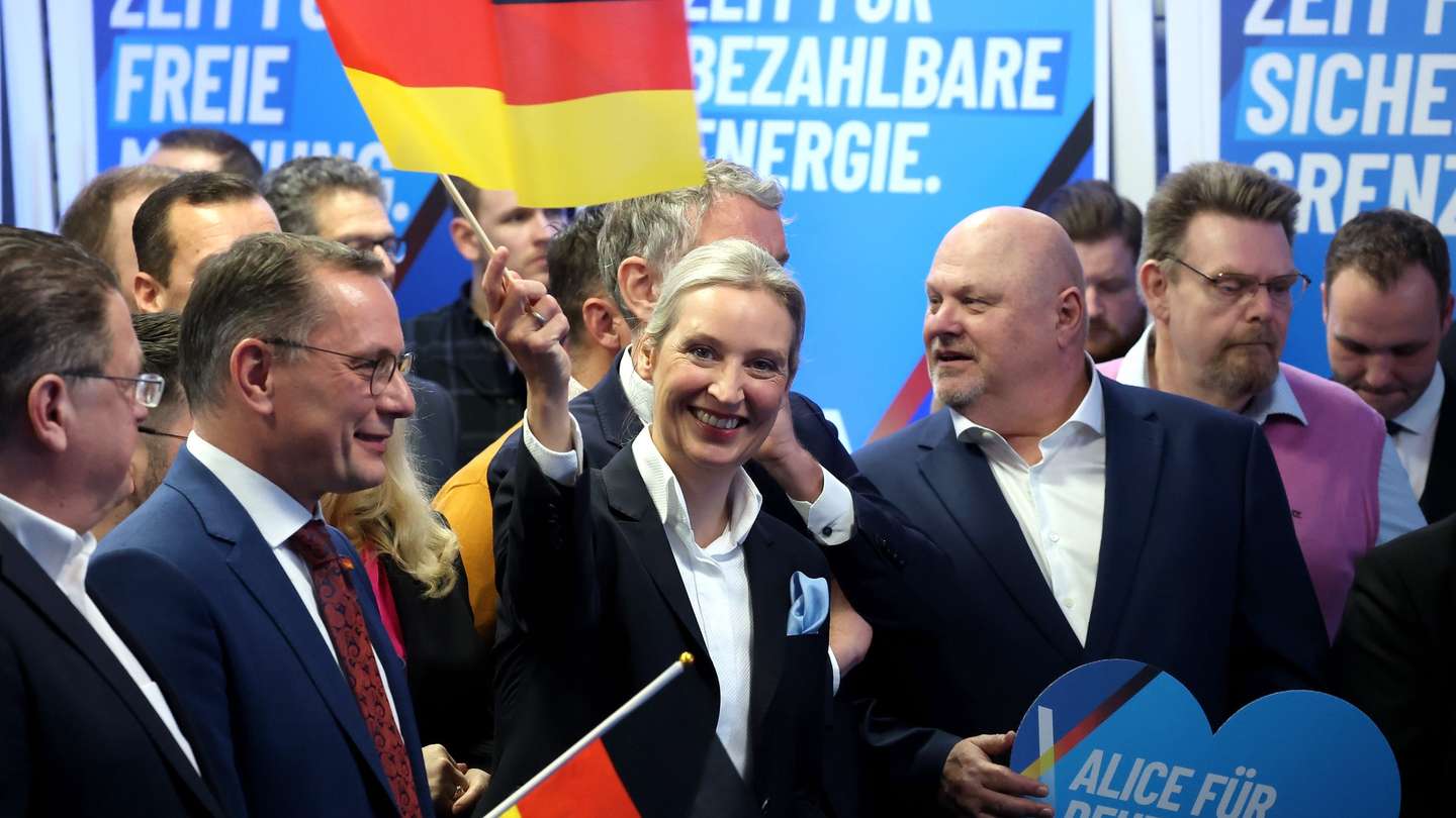 epa11918933 Alternative for Germany (AfD) party and faction co-chairwoman and top candidate for the federal election Alice Weidel (C) reacts to initial results during the Alternative for Germany (AfD) election event in Berlin, Germany, 23 February 2025. About 60 million Germans were eligible to vote in the elections for a new federal parliament, the 20th Bundestag.  EPA/FILIP SINGER