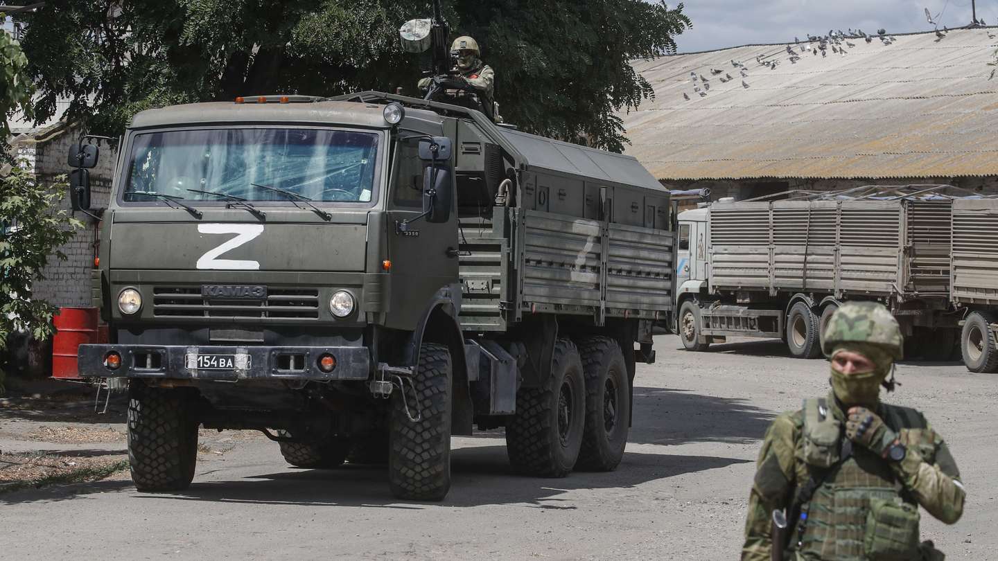 epa10072115 A picture taken during a visit to Melitopol organized by the Russian military shows Russian servicemen at a grain storage facility in Melitopol, Zaporizhia region, southeastern Ukraine, 14 July 2022. (issued 15 July 2022). The conflict in Ukraine has affected the availability and price of wheat worldwide. Melitopol is under the control of Russian forces and the city is administered by a military-civilian administration. On 24 February 2022 Russian troops entered the Ukrainian territory in what the Russian president declared a 'Special Military Operation', starting an armed conflict that has provoked destruction and a humanitarian crisis. The letter Z, painted on Russian military vehicles in Ukraine, has become a symbol of support for the Russian army.  EPA/SERGEI ILNITSKY