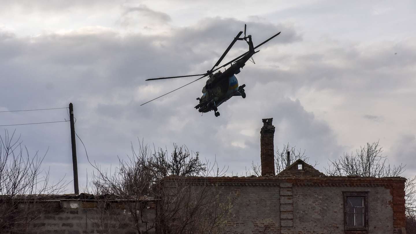 epa10564639 An MI-8 helicopter flies at an undisclosed location in eastern Ukraine, 08 April 2023. Russian troops entered Ukrainian territory on 24 February 2022, starting a conflict that has provoked destruction and a humanitarian crisis.  EPA/OLEG PETRASYUK