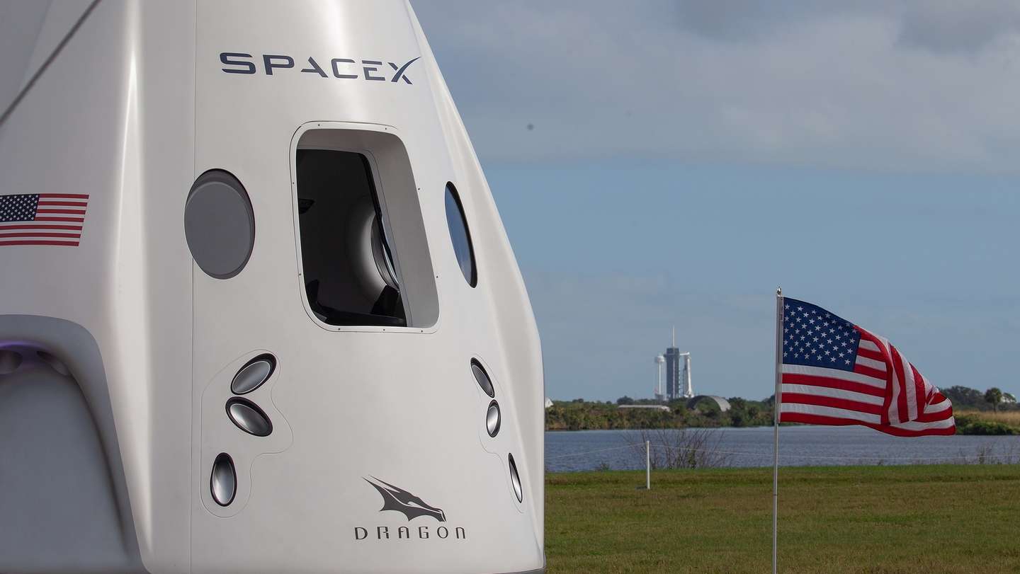 epa08818360 A model of Dragon crew capsule (L) is seen with the SpaceX rocket Resilience on the launch pad one day before the launch at the John F. Kennedy Space Center, on Merritt Island, Cape Canaveral, Florida, USA, 13 November 2020. The Crew-1 astronauts are scheduled to launch onboard the SpaceX&#039;s Crew Dragon spacecraft on 14 November 2020 to join the Expedition 64 crew aboard the International Space Station, increasing the crew to seven astronauts.  EPA/CJ GUNTHER