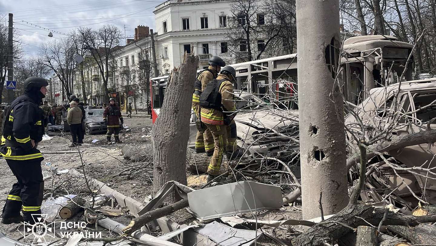 epa12029025 A handout photo made available by the State Emergency Service of Ukraine (SES) shows Ukrainian rescuers working at the site of a rocket strike in downtown Sumy, Ukraine, 13 April 2025, amid the ongoing Russian invasion. At least 31 people were killed, including two children, and 84 people were injured, including 10 children, after a Russian rocket hit downtown Sumy in the morning, according to a report by the State Emergency Service.  EPA/STATE EMERGENCY SERVICE OF UKRAINE HANDOUT  HANDOUT EDITORIAL USE ONLY/NO SALES