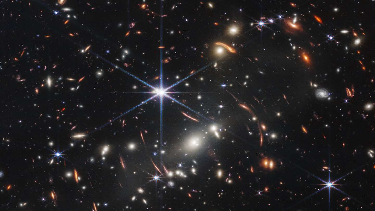 epa10065873 A handout photo made available by Space Telescope Science Institute Office of Public Outreach shows Webb's First Deep Field  taken by Webb's Near-Infrared Camera (NIRCam), a composite made from images at different wavelengths, totaling 12.5 hours, of galaxy cluster SMACS 0723 as it appeared 4.6 billion years ago. The combined mass of this galaxy cluster acts as a gravitational lens, magnifying much more distant galaxies behind it. Webb’s NIRCam has brought those distant galaxies into sharp focus – they have tiny, faint structures that have never been seen before, including star clusters and diffuse features. Researchers will soon begin to learn more about the galaxies' masses, ages, histories, and compositions, as Webb seeks the earliest galaxies in the universe.  EPA/Space Telescope Science Institute Office of Public Outreach HO  EPA-EFE/Space Telescope Science Institute Office of Public Outreach HO  HANDOUT EDITORIAL USE ONLY/NO SALES