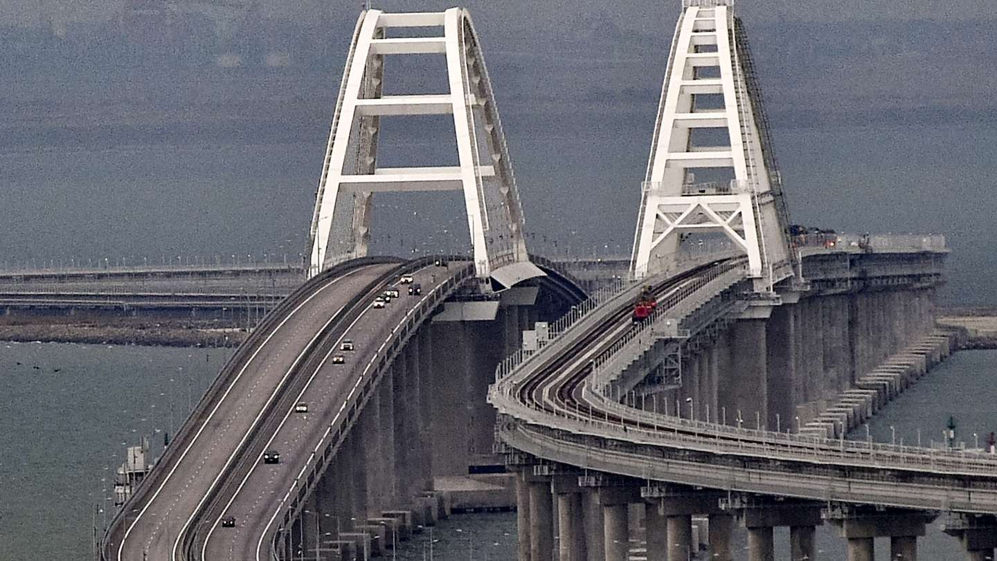 epa10232212 Cars move on the Kerch Strait bridge in Crimea, 09 October 2022. Automobile traffic on the undamaged part of the Crimean bridge has been restored, the head of the annexed Crimea Sergey Aksyonov announced. The previous day, Russian authorities said that "an explosion was set off at a cargo vehicle on the motorway part of the Crimean bridge on the side of the Taman peninsula, which set fire to seven fuel tanks of a train that was en route to the Crimean peninsula. Two motorway sections of the bridge partially collapsed."  EPA/STRINGER