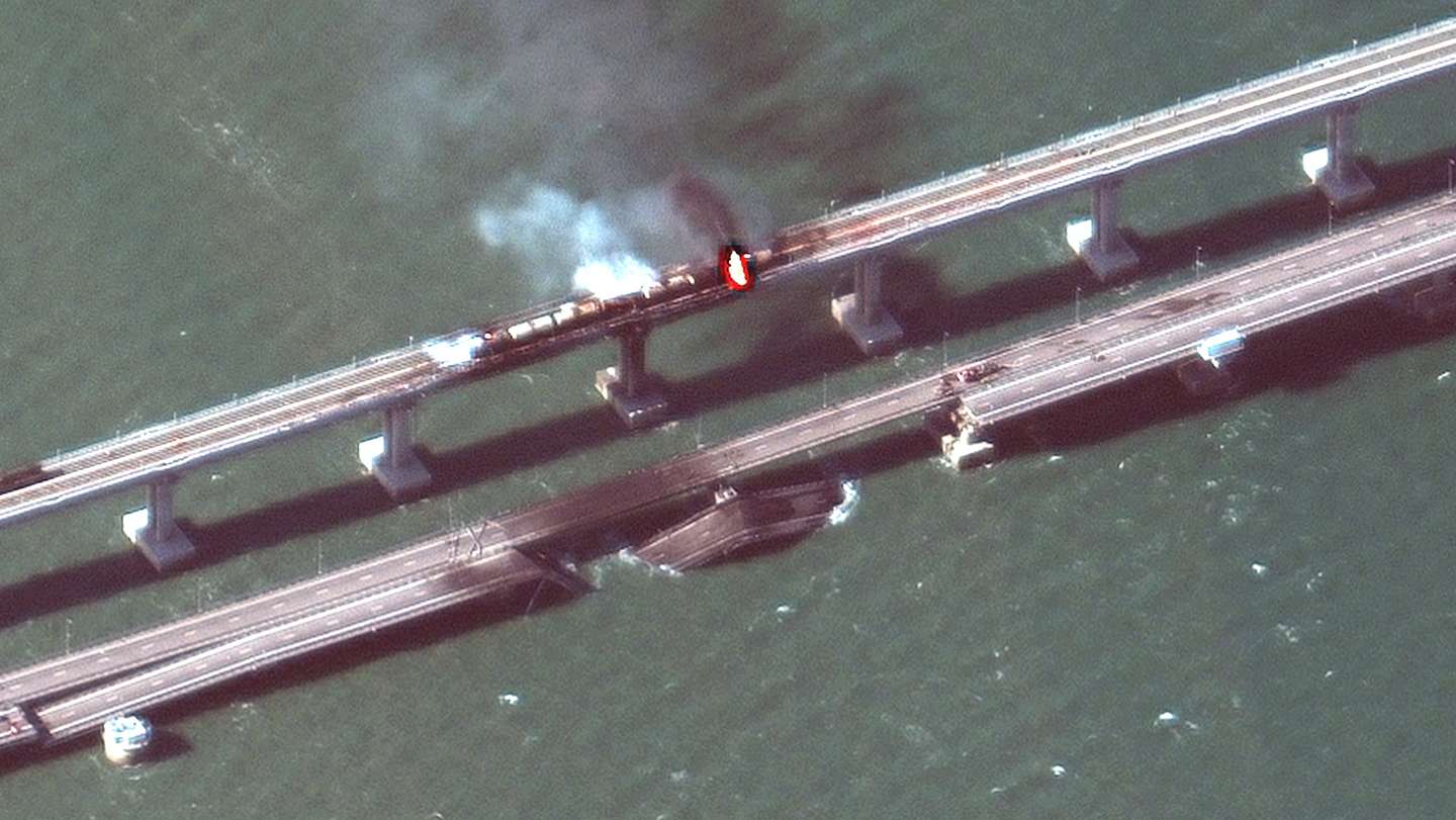 epa10231797 A handout satellite image made available by Maxar Technologies shows smoke and a collapsed part of the Kerch Strait bridge in Crimea, 08 October 2022. According to Russian authorities, 'an explosion was set off at a cargo vehicle on the motorway part of the Crimean bridge on the side of the Taman peninsula, which set fire to seven fuel tanks of a train that was en route to the Crimean peninsula. Two motorway sections of the bridge partially collapsed.'  EPA/MAXAR TECHNOLOGIES HANDOUT -- MANDATORY CREDIT: SATELLITE IMAGE 2022 MAXAR TECHNOLOGIES -- THE WATERMARK MAY NOT BE REMOVED/CROPPED -- HANDOUT EDITORIAL USE ONLY/NO SALES HANDOUT EDITORIAL USE ONLY/NO SALES HANDOUT EDITORIAL USE ONLY/NO SALES