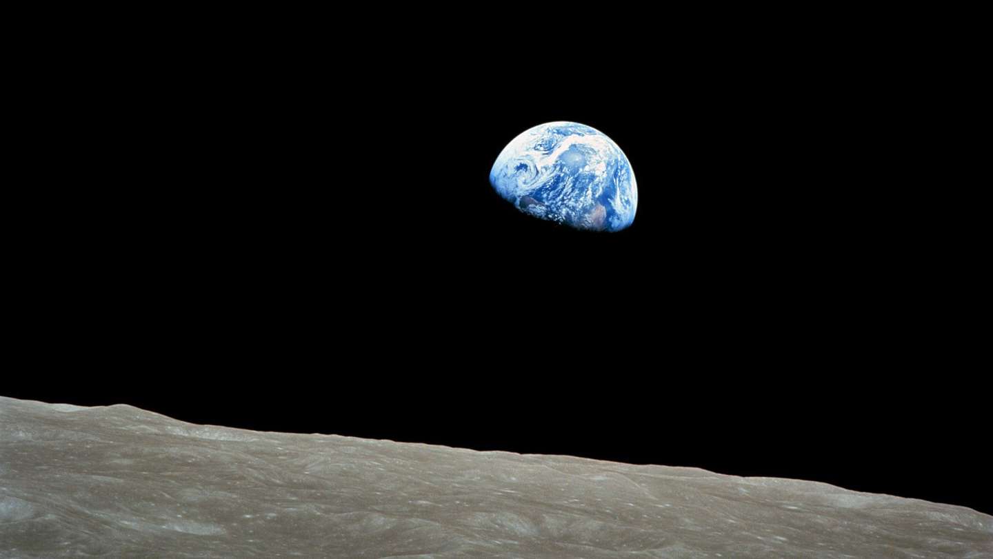 epa04000723 A handout picture released by NASA on 25 December 2013 shows a view of planet Earth seen from the Moon, at space, 24 December 1968. The Apollo Eight crew flew from Earth to the Moon and back again. Frank Borman, James Lovell, and William Anders were launched atop a Saturn V rocket on 21 December 1968, circled the Moon ten times in their command module, and returned to Earth on 27 December 1968. The Apollo Eight mission's impressive list of firsts includes: the first humans to journey to the Earth's Moon, the first to fly using the Saturn V rocket, and the first to photograph the Earth from deep space. As the Apollo Eight command module rounded the far side of the Moon on 24 December 1968, the crew could look toward the lunar horizon and see the Earth appear to rise, due to their spacecraft's orbital motion. Their famous picture of a distant blue Earth above the Moon's limb was a marvelous gift to the world.  EPA/NASA  HANDOUT EDITORIAL USE ONLY