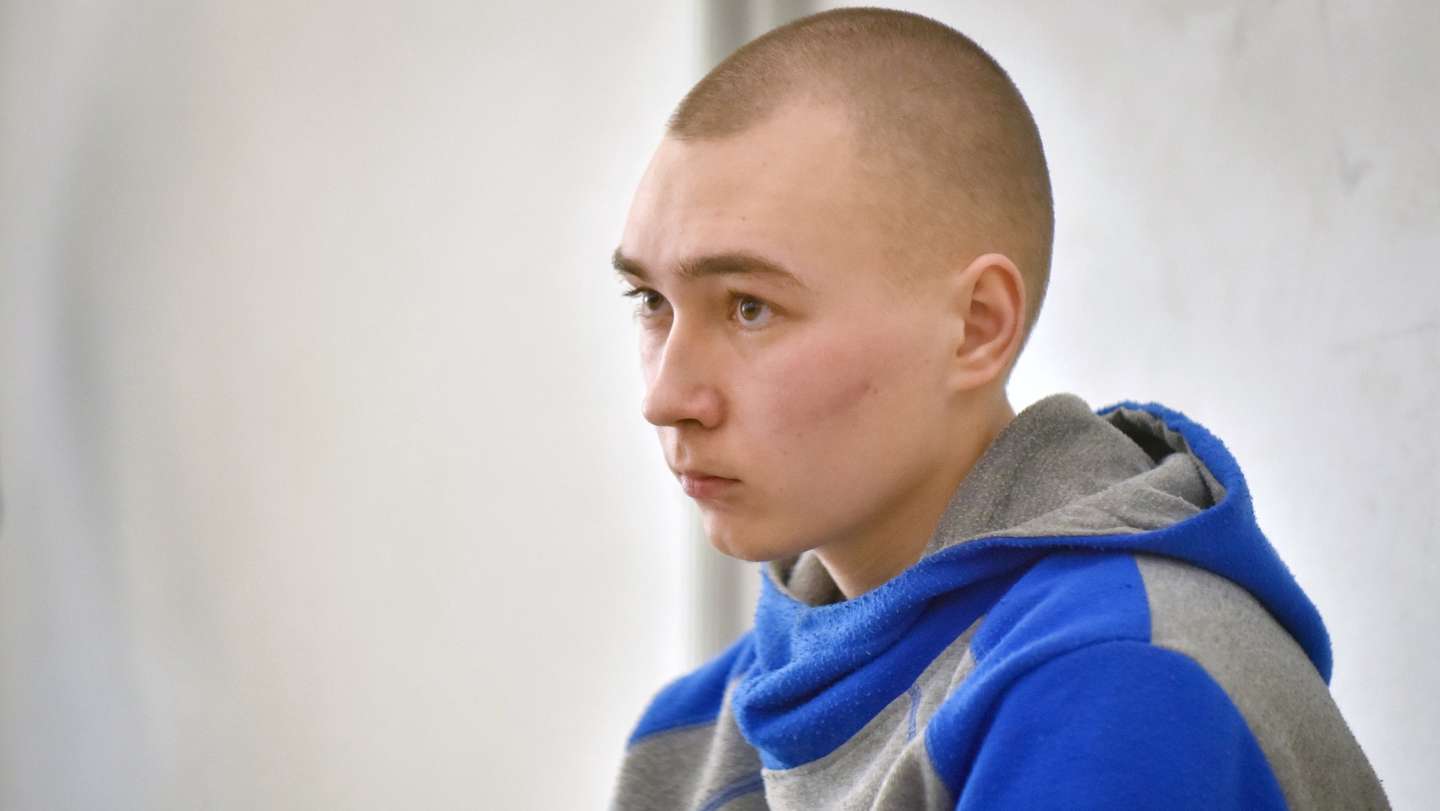 epa09957498 Russian serviceman Vadim Shishimarin sits in the dock on the second day of his war crimes trial in the Solomyansky district court in Kyiv, Ukraine, 19 May 2022. Shishimarin on the first day pleaded guilty to charges of killing an unarmed 62-year-old civilian man as Shishimarin fled with four other soldiers near Chupakha village in the Sumy area. Ukraine is holding the first war crimes trial amid the Russian invasion. Shishimarin faces possible life imprisonment if found guilty as the prosecutor's general office said.  EPA/OLEG PETRASYUK