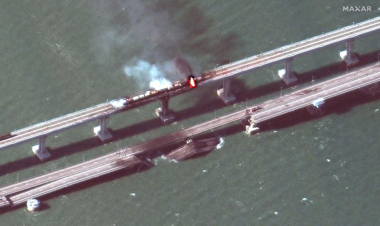 epa10231797 A handout satellite image made available by Maxar Technologies shows smoke and a collapsed part of the Kerch Strait bridge in Crimea, 08 October 2022. According to Russian authorities, 'an explosion was set off at a cargo vehicle on the motorway part of the Crimean bridge on the side of the Taman peninsula, which set fire to seven fuel tanks of a train that was en route to the Crimean peninsula. Two motorway sections of the bridge partially collapsed.'  EPA/MAXAR TECHNOLOGIES HANDOUT -- MANDATORY CREDIT: SATELLITE IMAGE 2022 MAXAR TECHNOLOGIES -- THE WATERMARK MAY NOT BE REMOVED/CROPPED -- HANDOUT EDITORIAL USE ONLY/NO SALES HANDOUT EDITORIAL USE ONLY/NO SALES HANDOUT EDITORIAL USE ONLY/NO SALES