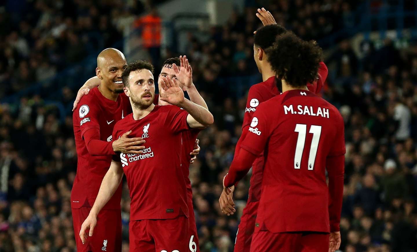 epa10577600 Diogo Jota (C) of Liverpool celebrates with teammates after scoring his second goal during the English Premier League soccer match between Leeds United and Liverpool in Leeds, Britain, 17 April 2023.  EPA/ADAM VAUGHAN EDITORIAL USE ONLY. No use with unauthorized audio, video, data, fixture lists, club/league logos or 'live' services. Online in-match use limited to 120 images, no video emulation. No use in betting, games or single club/league/player publications