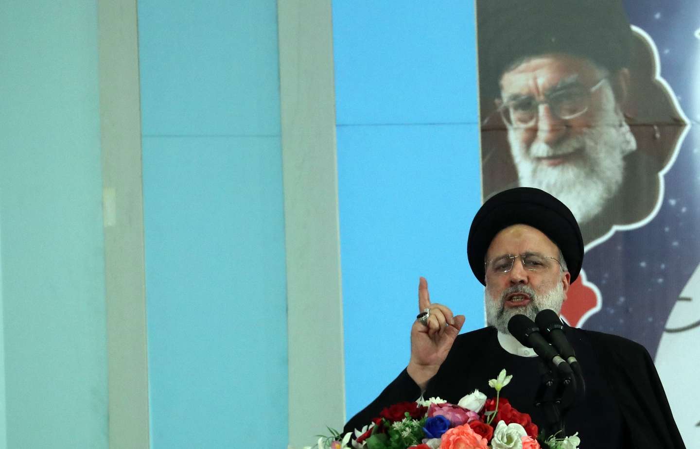 epa10387329 Iranian President Ebrahim Raisi greets the crowd as he arrives at a ceremony marking the third death anniversary of Iranian Revolutionary Guards Corps (IRGC) Lieutenant General and Commander of the Quds Force Qasem Soleimani, at the Mosallah Mosque in Tehran, Iran, 03 January 2023. Soleimani was killed on 03 January 2020 in a targeted US airstrike at the Baghdad airport, Iraq.  EPA/ABEDIN TAHERKENAREH