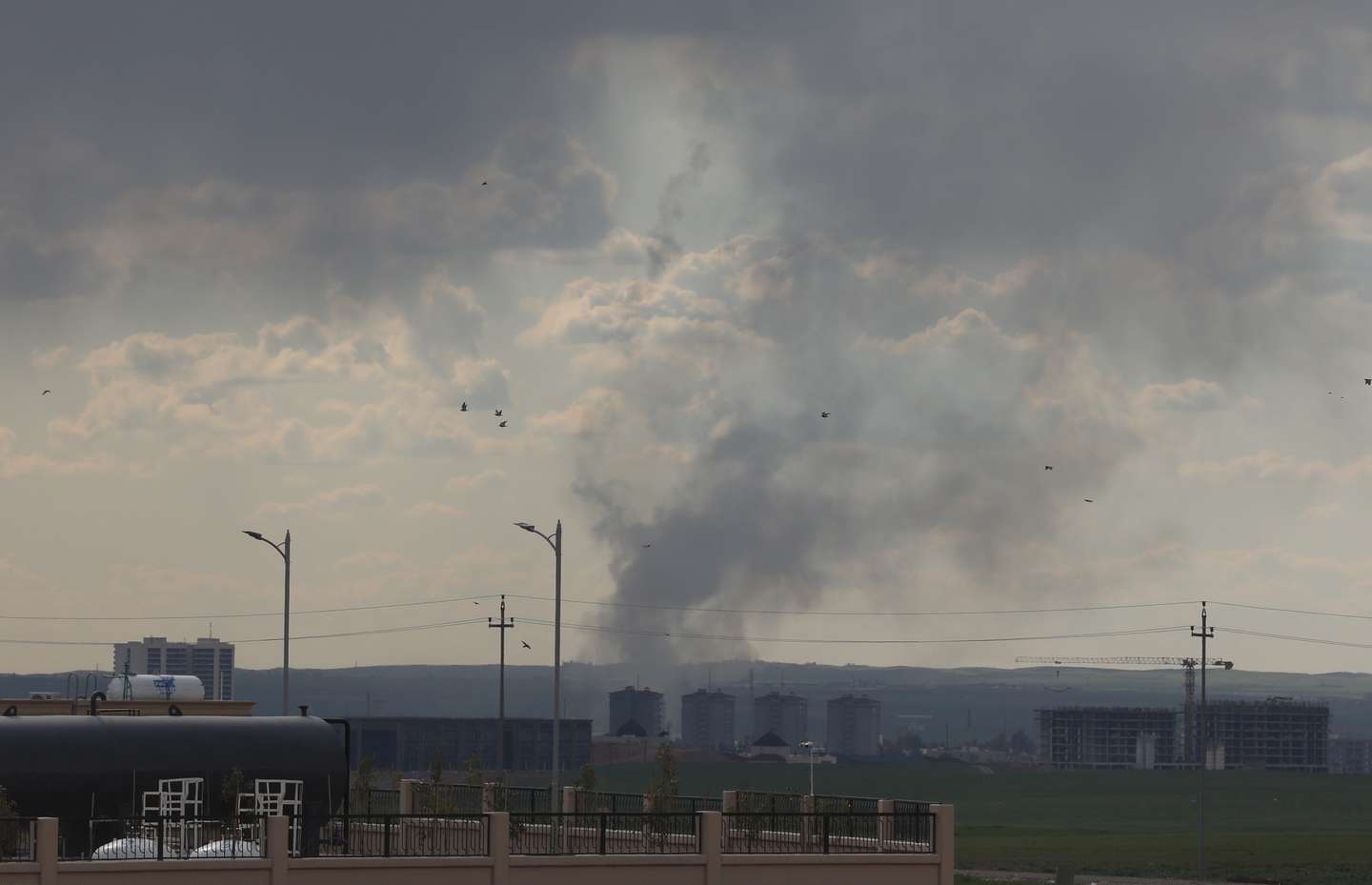 epa12783423 Smoke rises following an Iranian drone attack on Erbil airport in Erbil, Iraq, 28 February 2026. Several drones were shot down over Erbil today after Iran reportedly launched retaliatory aerial attacks targeting US military positions in the region, including areas near the American consulate and Erbil International Airport. A joint Israeli and US military operation targeted multiple locations across Iran in the early hours of 28 February 2026.  EPA/GAILAN HAJI