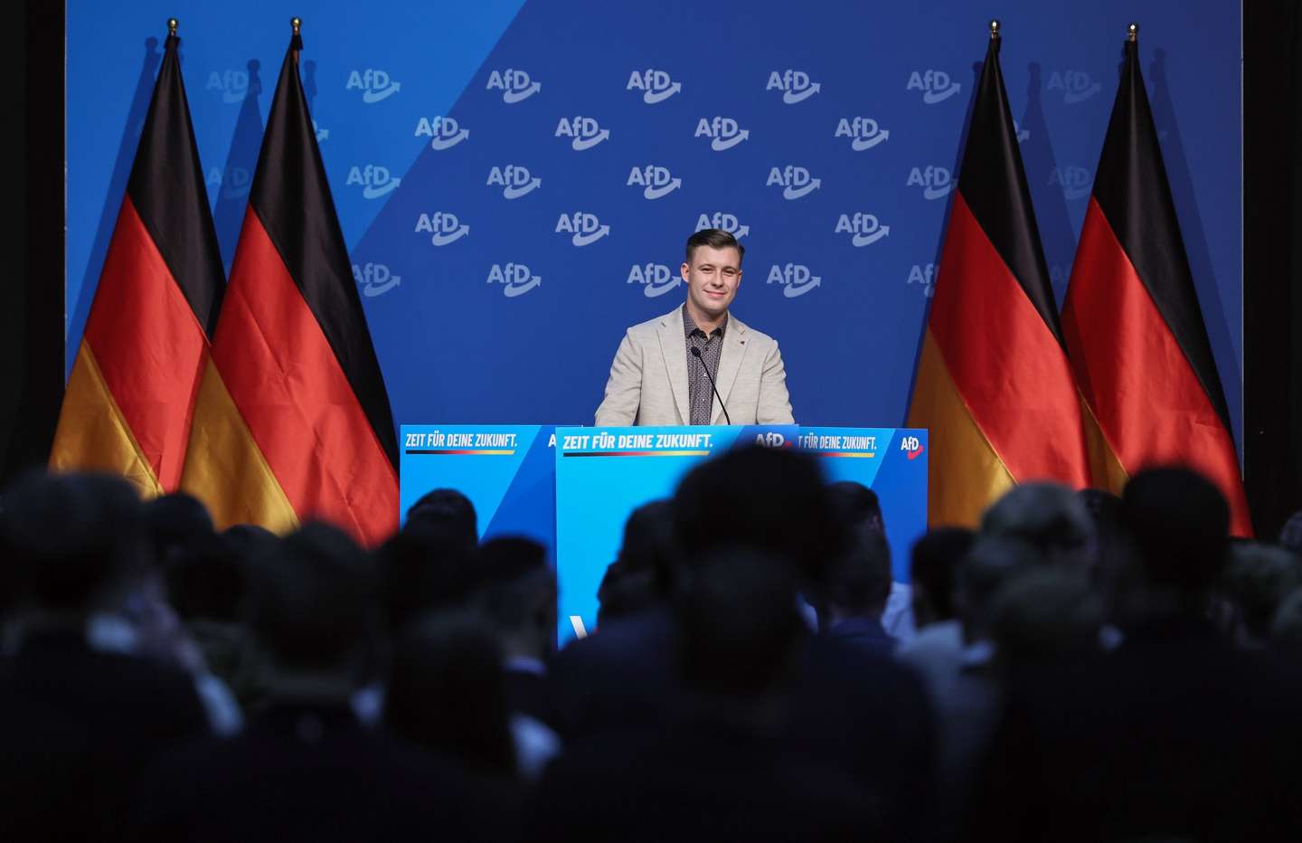 epa12557187 Brandenburg state parliament member and candidate for leadership of the new AfD youth organizaton, Jean-Pascal Hohm, speaks at a founding congress of the new youth wing of the Alternative for Germany (AfD) party in Giessen, Germany, 29 November 2025. The far-right party is launching a new youth organization, called 'Generation Deutschland' (Generation Germany). Its predecessor was declared to be right-wing extremist by German security authorities. The police estimate that 40,000 anti-AfD demonstrators could come to Giessen.  EPA/RONALD WITTEK