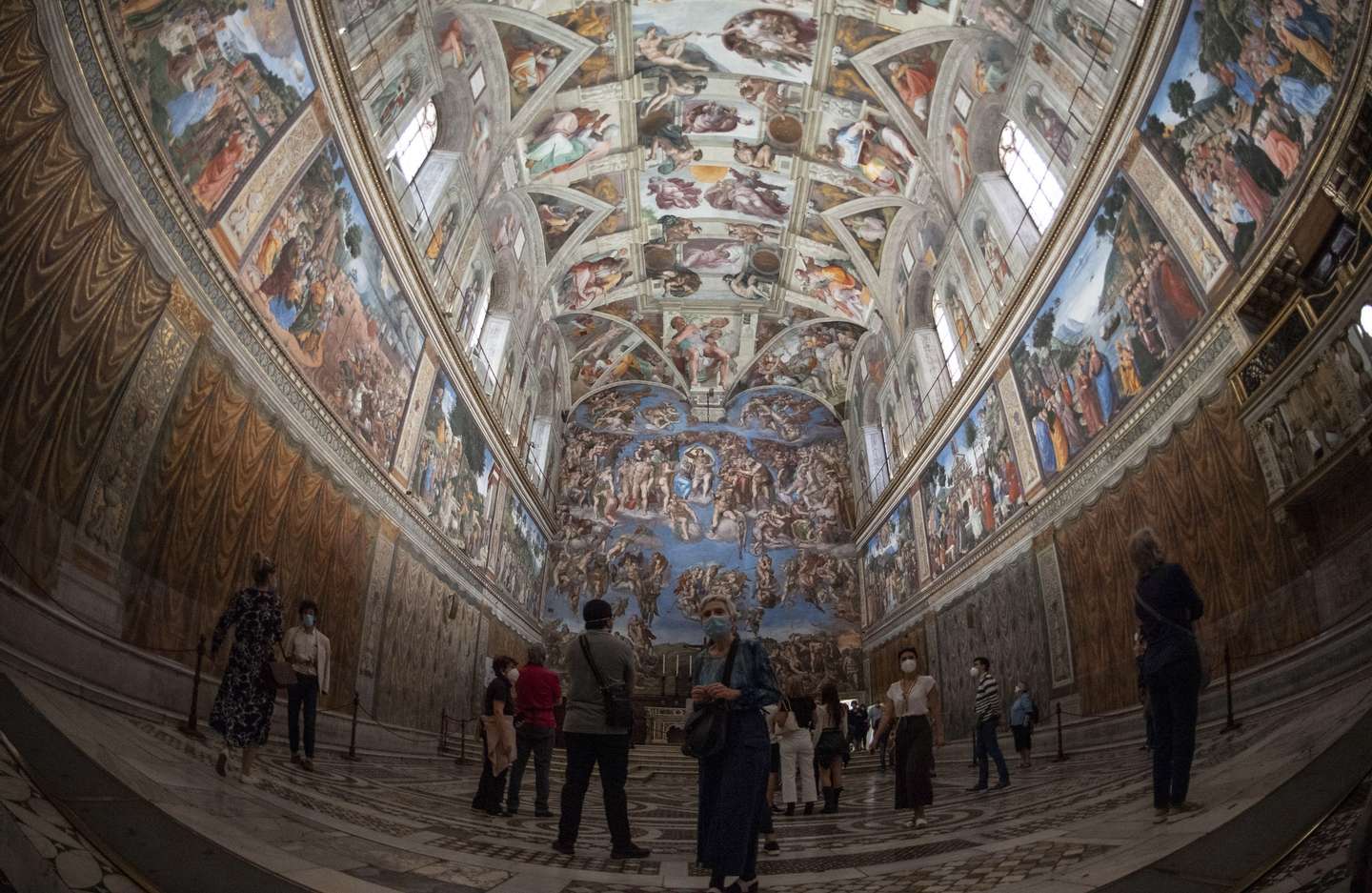 epa08458321 Visitors admire the Sistine Chapel as Vatican Museums reopened, Vatican City, 01 June 2020. The Vatican Museums reopened on 01 June 2020 to visitors after three months of shutdown following COVID-19 containment measures.  EPA/MAURIZIO BRAMBATTI   EDITORIAL USE ONLY  EDITORIAL USE ONLY