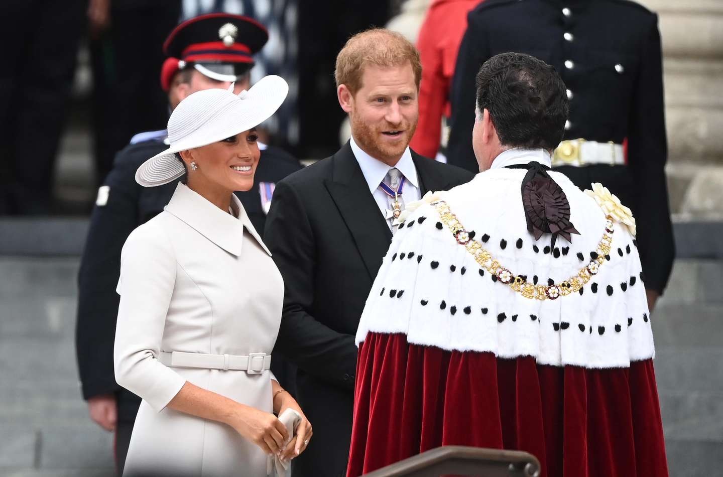 epa09993346 Meghan Markle (L), the Duchess of Sussex, and Prince Harry, The Duke of Sussex (C) arrive for the National Service of Thanksgiving as part of the celebrations of the Platinum Jubilee of Queen Elizabeth II, at St Paul's Cathedral in London, Britain, 03 June 2022. Queen Elizabeth II will not be attending the service after experiencing 'discomfort'. The service celebrates the Queen's Platinum Jubilee, marking the 70th anniversary of her accession to the throne on 06 February 1952.  EPA/NEIL HALL