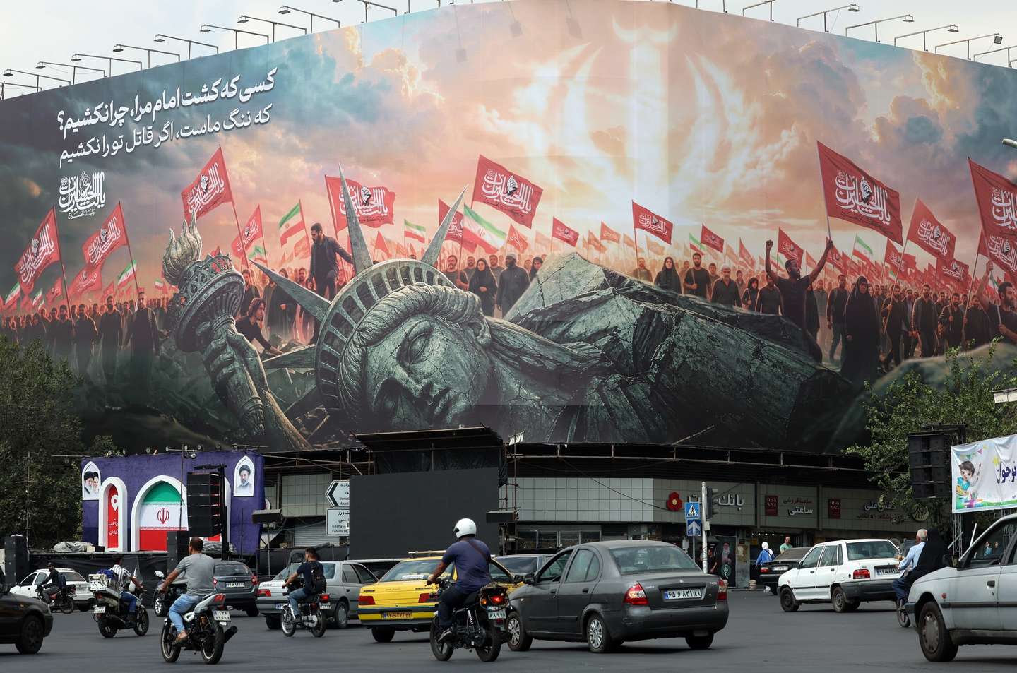 epa13224596 Iranians drive past an anti-US billboard in Tehran, Iran, 09 September 2026. Iran’s Islamic Revolutionary Guard Corps (IRGC) claims to have captured a US military underwater drone at the entrance to the Strait of Hormuz as the conflict between Iran and the US continues as both sides trade fire.  EPA/ABEDIN TAHERKENAREH RESTRICTIONS: ISRAEL OUT- NO Access Israel Media/Persian Language TV Stations Outside Iran/Strictly No Access BBC Persian/VOA Persian/Manoto TV/Iran International TV. (As mandated by Iran's Directorate General for Foreign Media)