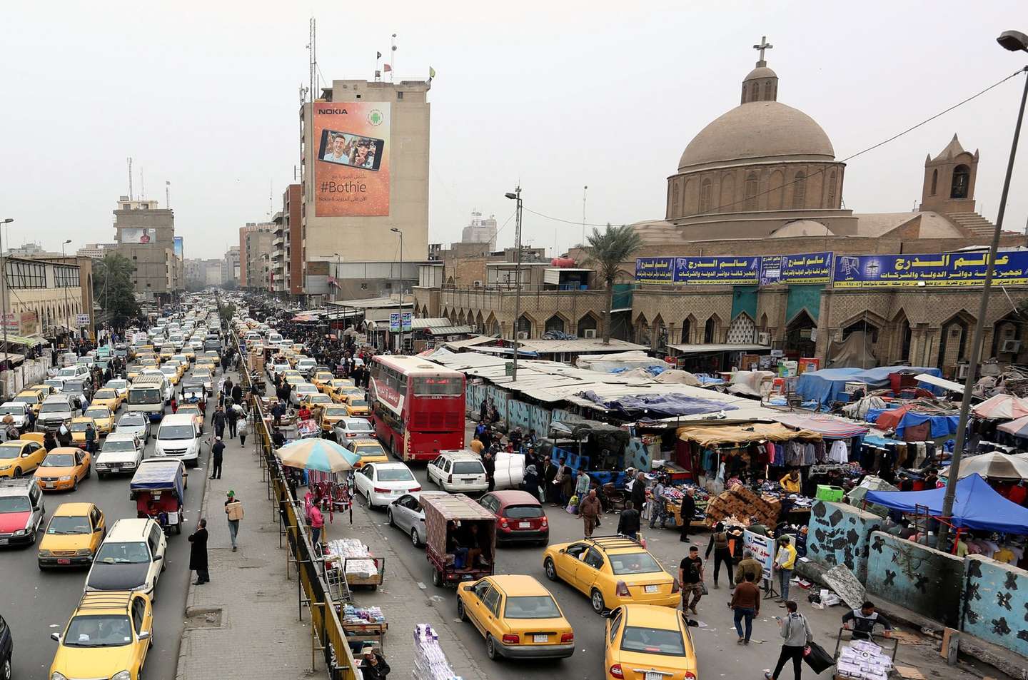 epa06521771 Vehicles drive next to Shorja market at central Baghdad, Iraq, 13 February 2018. An international donor conference was held in Kuwait on 12 February to raise funds for Iraq's reconstruction following its three-year war against Islamic State (IS), as the Iraqi government said it would need an estimated 88.2 billion US dollars for reconstruction.  EPA/ALI ABBAS