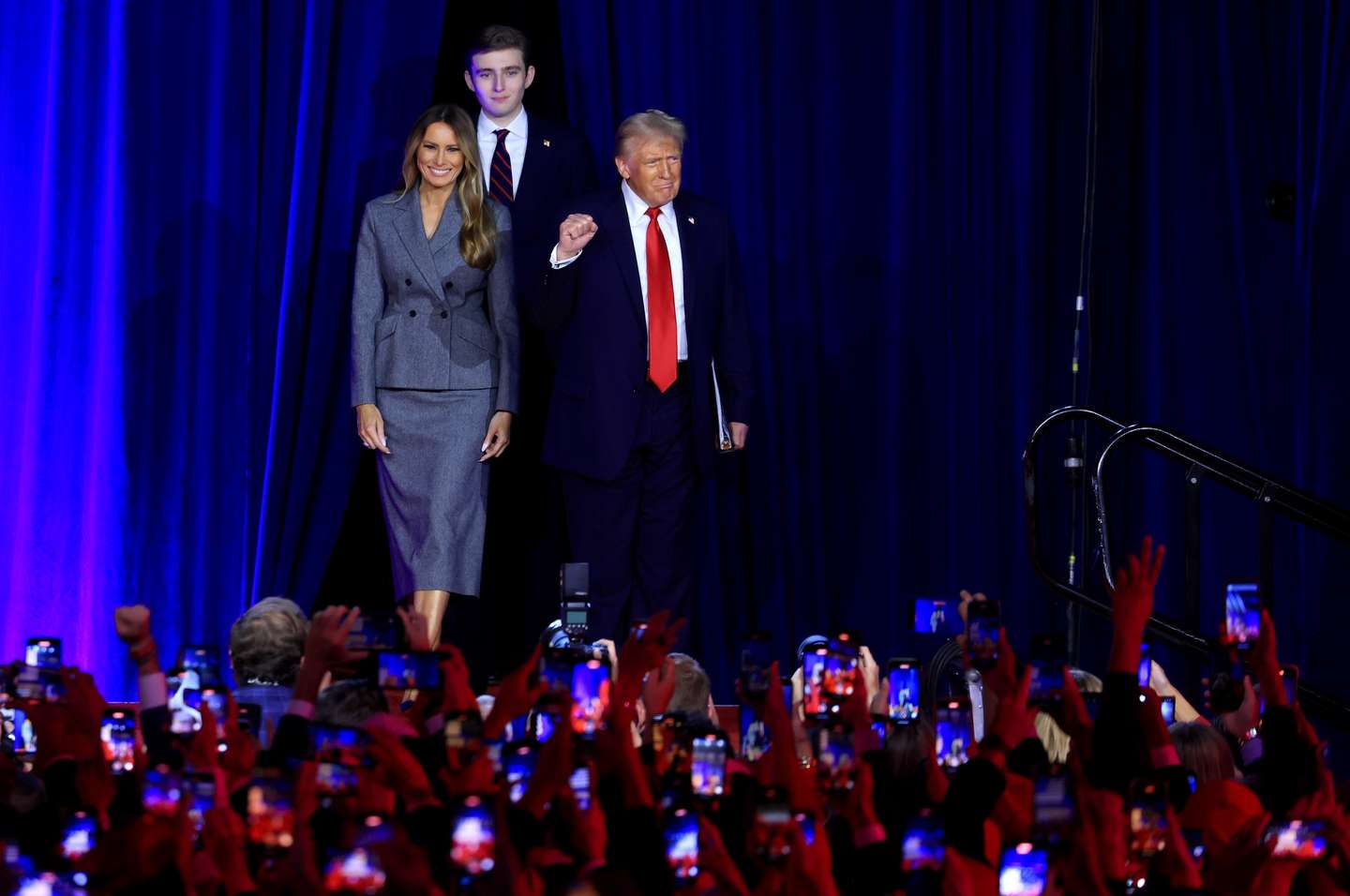 epaselect epa11704651 Republican presidential candidate Donald J. Trump, joined by his wife Melania Trump and their son Barron Trump, arrives on stage to address supporters at the Election Night watch party in the West Palm Beach Convention Center in West Palm Beach, Florida, USA, 06 November 2024.  EPA/CRISTOBAL HERRERA-ULASHKEVICH