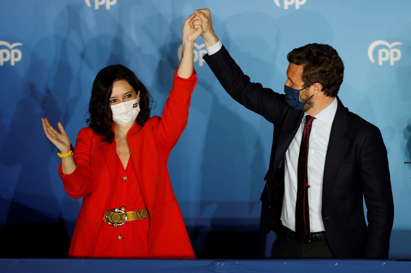 epa09177947 Madrid's regional president and candidate to reelection Isabel Diaz Ayuso (L) and People's Party Part Leader Pablo Casado react as they wait for Madrid's regional elections results closing to the party's headquarters in Madrid, central Spain, 04 May 2021. Isabel Diaz Ayuso could be reelected with between 62 and 65 deputies but would need the support of far-right Vox to form a governmet, according Spanish media.  EPA/Mariscal
